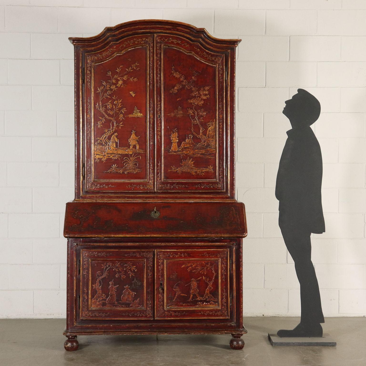 Bureau bookcase composed of a cupboard with two doors and drop-leaf door with inner compartments as a base and upper case with shelves and two doors. Poplar interiors. The piece is made of walnut, completely lacquered with chinoiserie ornaments and