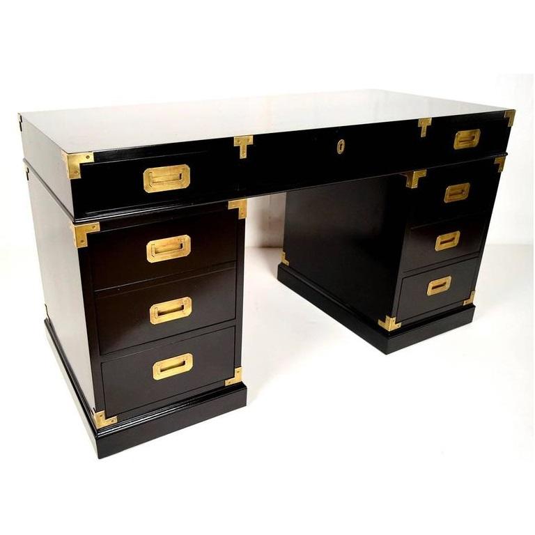 Professionally lacquered in back this fine quality desk has a wonderful look. Includes seven drawers, with a central drawer between the pedestals and two small drawers and one filing drawer on each side. The centre drawer has key lock. The brass