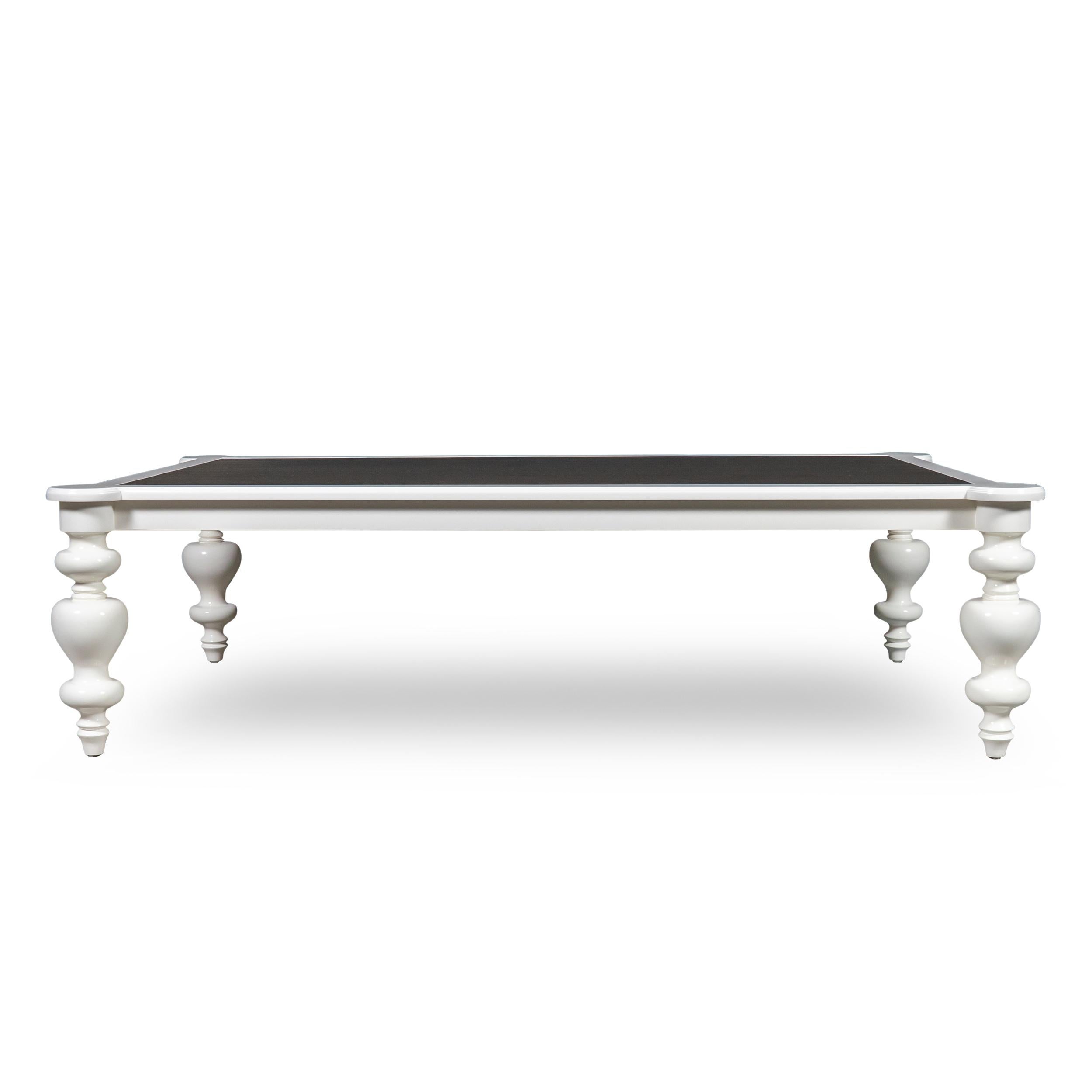 Hand carved cocktail coffee table with turned arabesque stacked ball legs. Inlaid with brushed brass. Lacquered in white dove by benjamin moore.

Measurements:
61