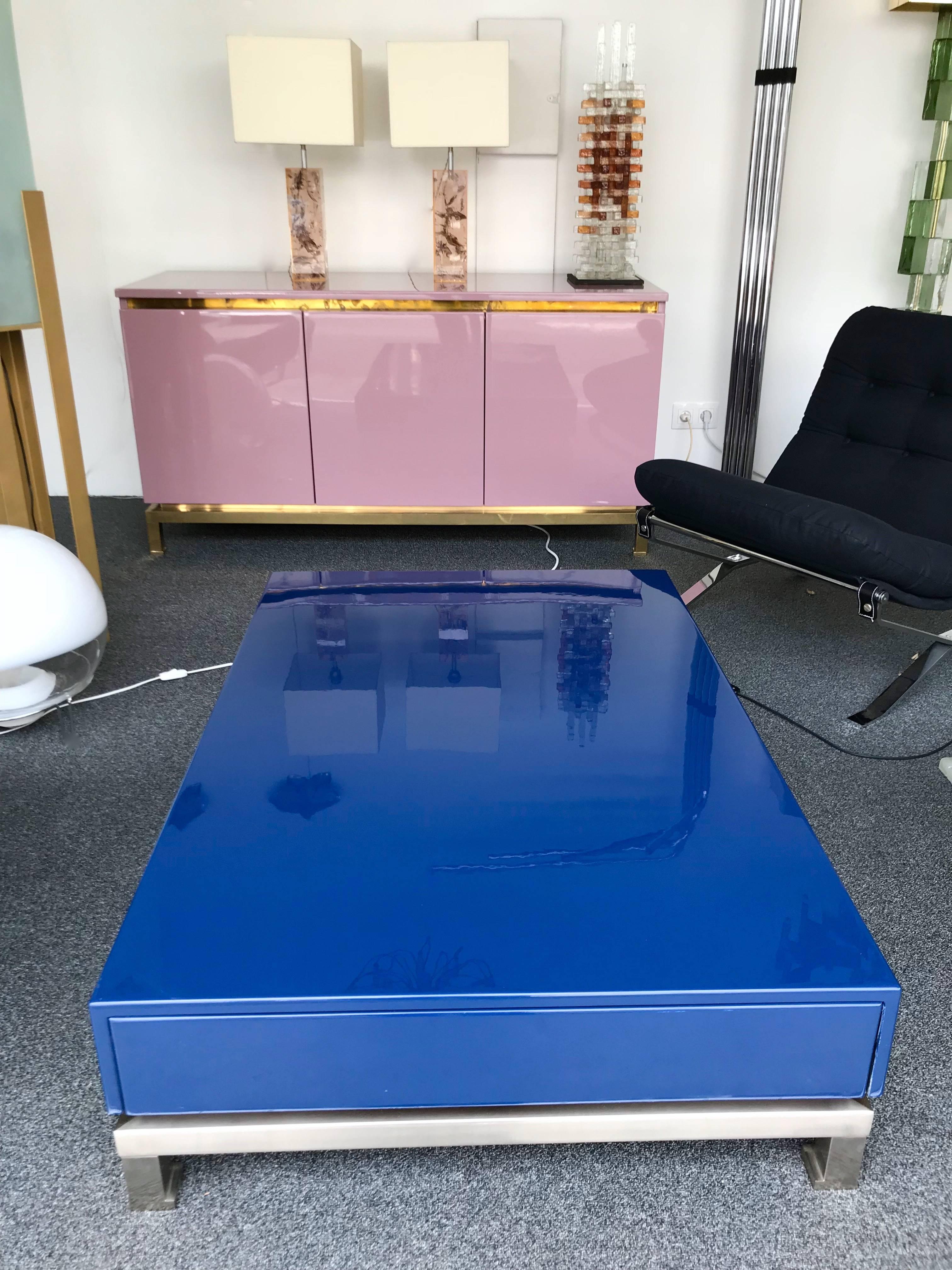 Blue lacquered coffee low or cocktail table by Guy Lefevre for Maison Jansen. A drawer on each side, interior mahogany wood, nickeled brass feet.