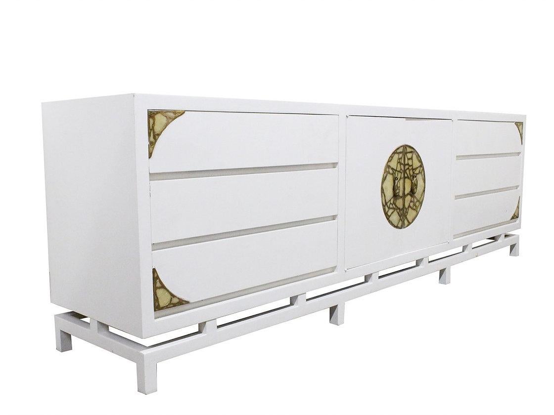 Lacquered Frank Kyle credenza/dresser with ornamental hardware made by Pepe Mendoza. This piece has visible wear and refinishing is recommended.

Dimensions:
96