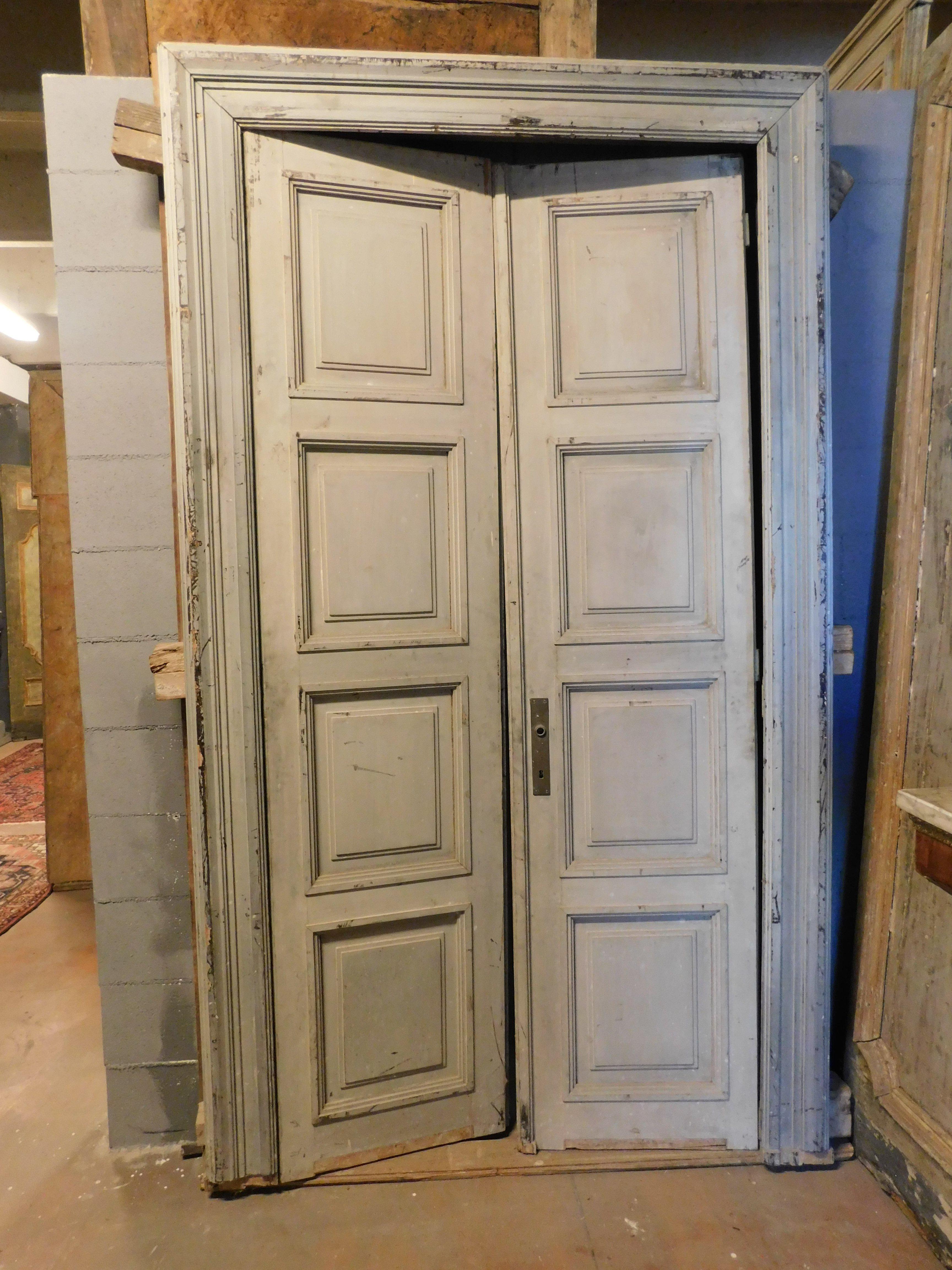 Vintage interior door, hand lacquered with two doors and original frame, decorated with eight sculpted panels, uniform color and gray patina over time, push opening, complete with frame, from Northern Italy, 1900s, maximum dimensions w 135 cm x H
