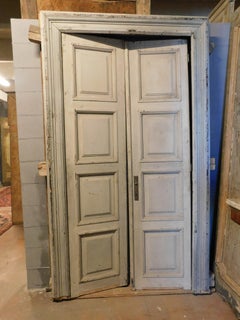Lacquered double door and frame, with eight carved panels, grey, Italy