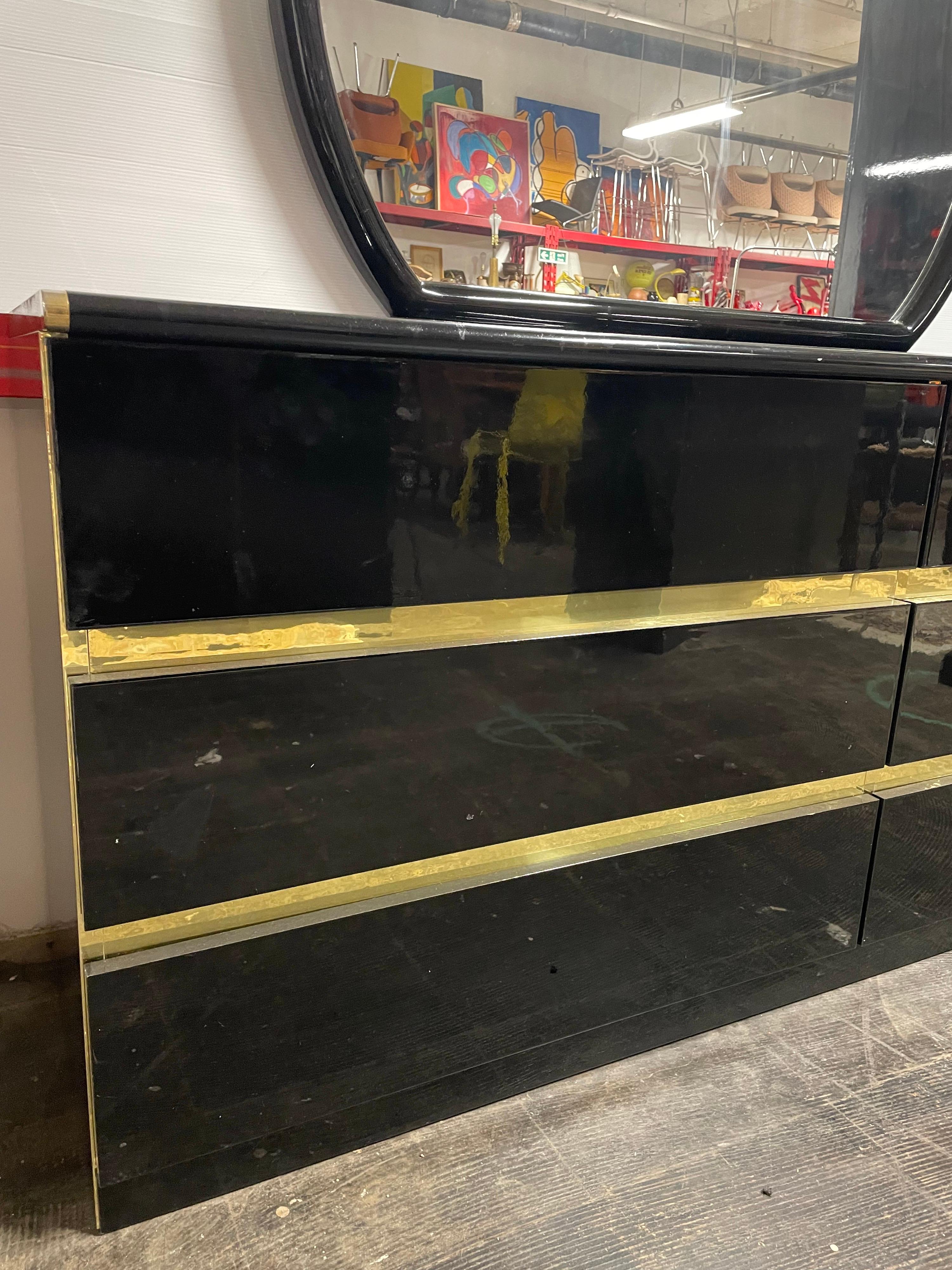 1980s black lacquer 6 drawer dresser with round mirror. Gold metallic accents/trim. Full bedroom set available on shop.