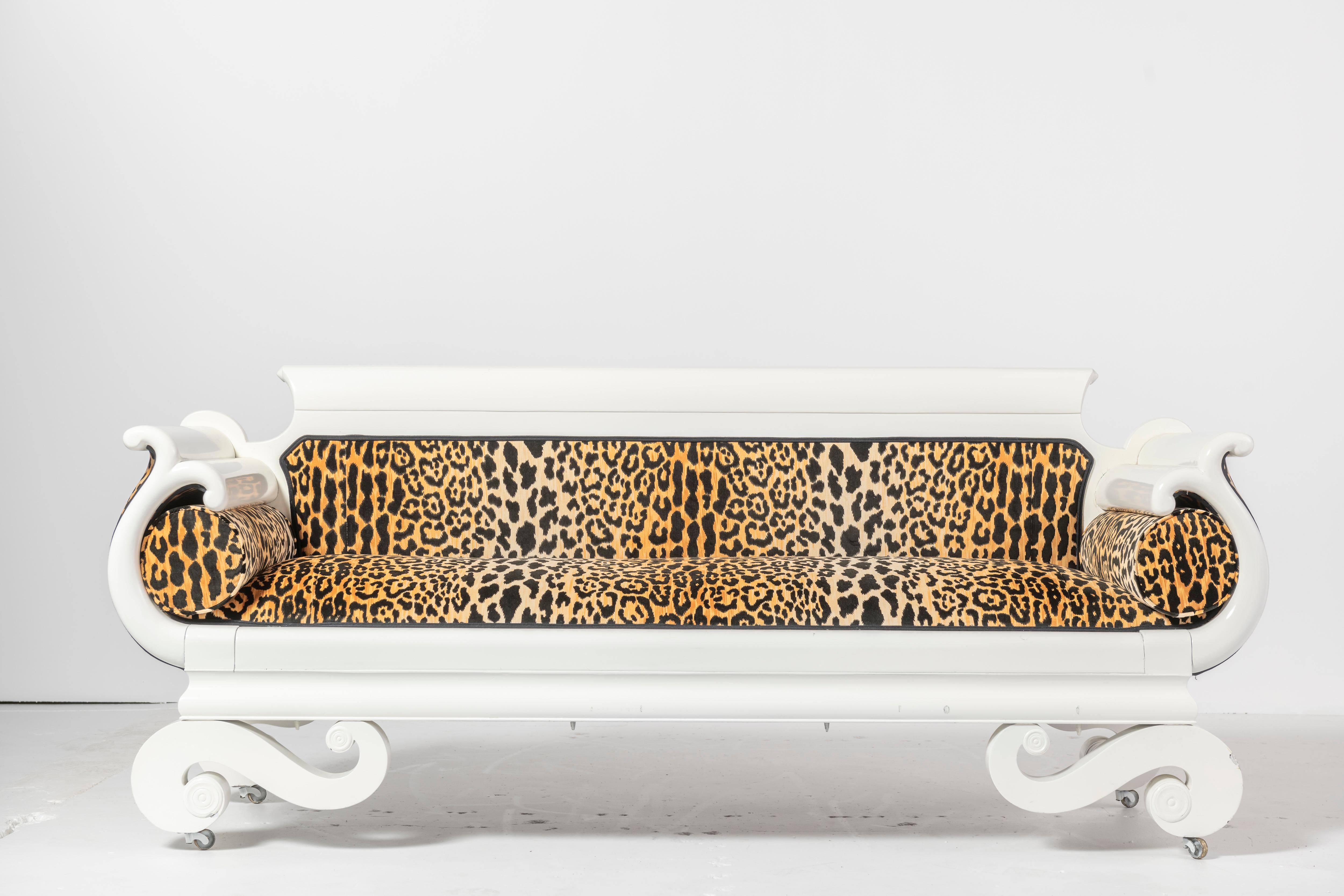 Great statement piece with white lacquer wood finish and leopard printed upholstery. Loads of drama for either a simple or layered decor.