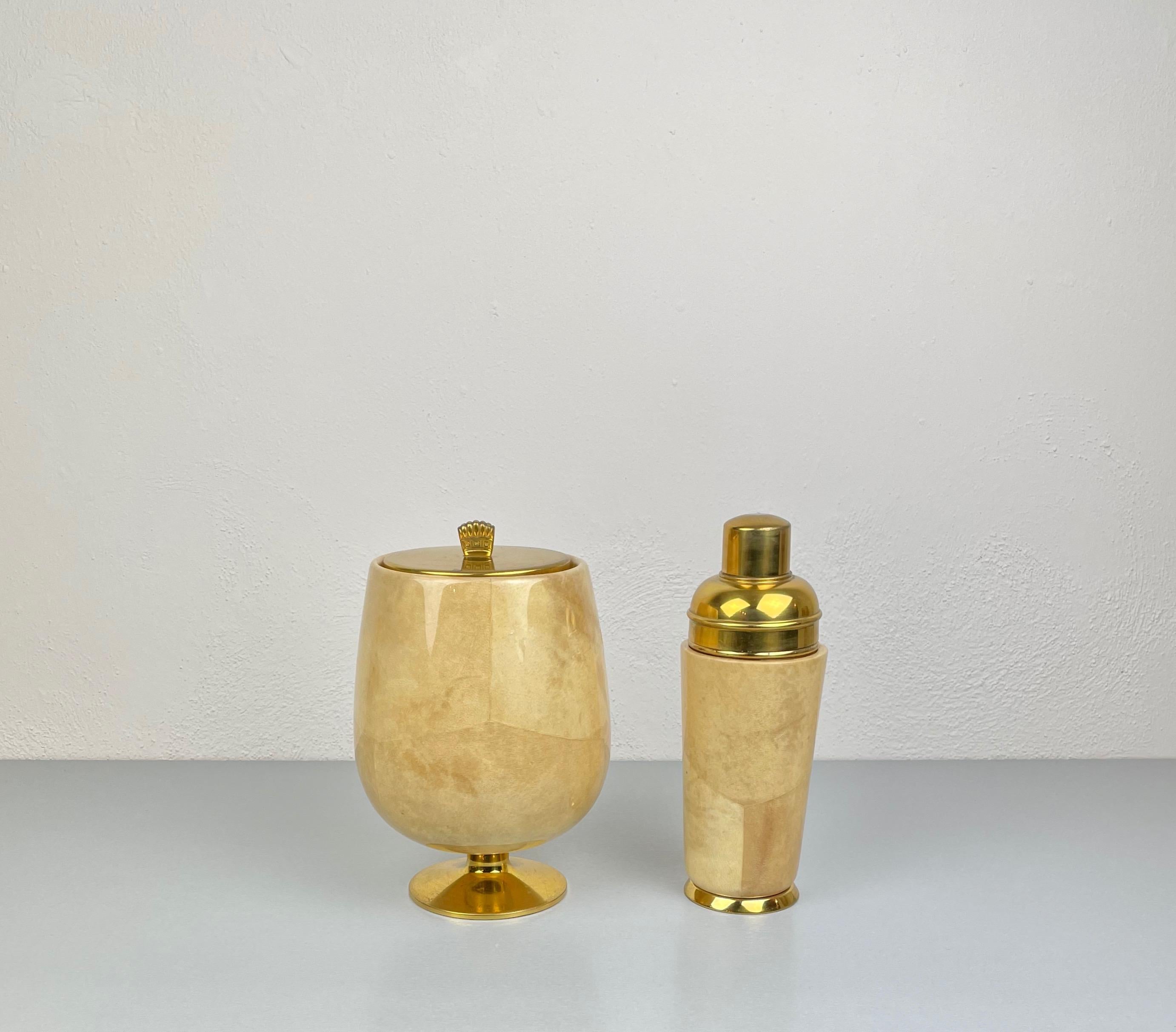 Set of ice bucket and shaker in lacquered beige goatskin and brass by Aldo Tura for Macabo, Italy, 1950s. 

The original stamp is still visible on the bottom as shown in the pictures.