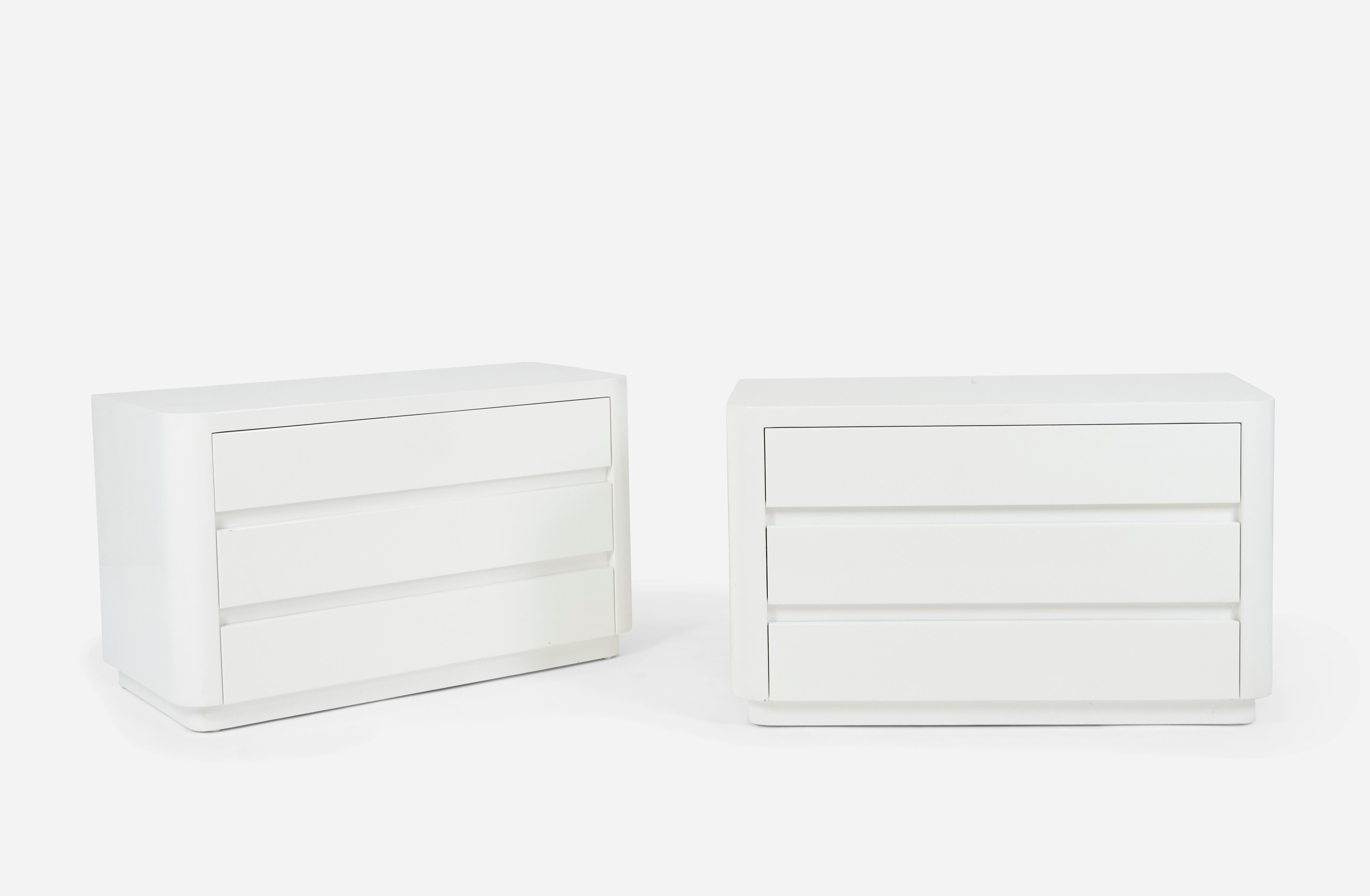 Pair of chests or large scale night stands by Karl Springer wrapped in goatskin. Each nightstand has 3 drawers. Beautiful bright white lacquer finish.