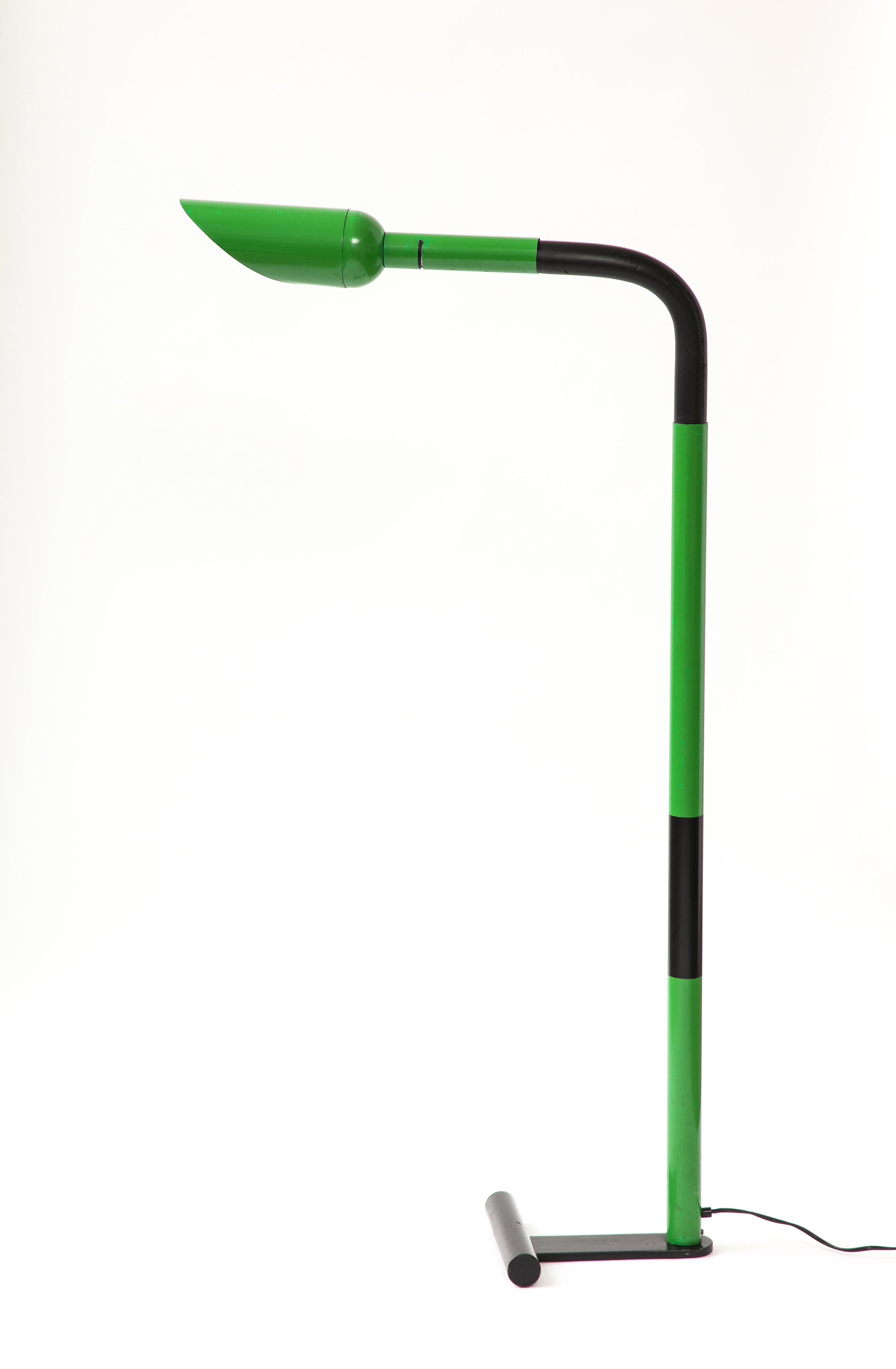 Lacquered green metal floor lamp with an adjustable neck.