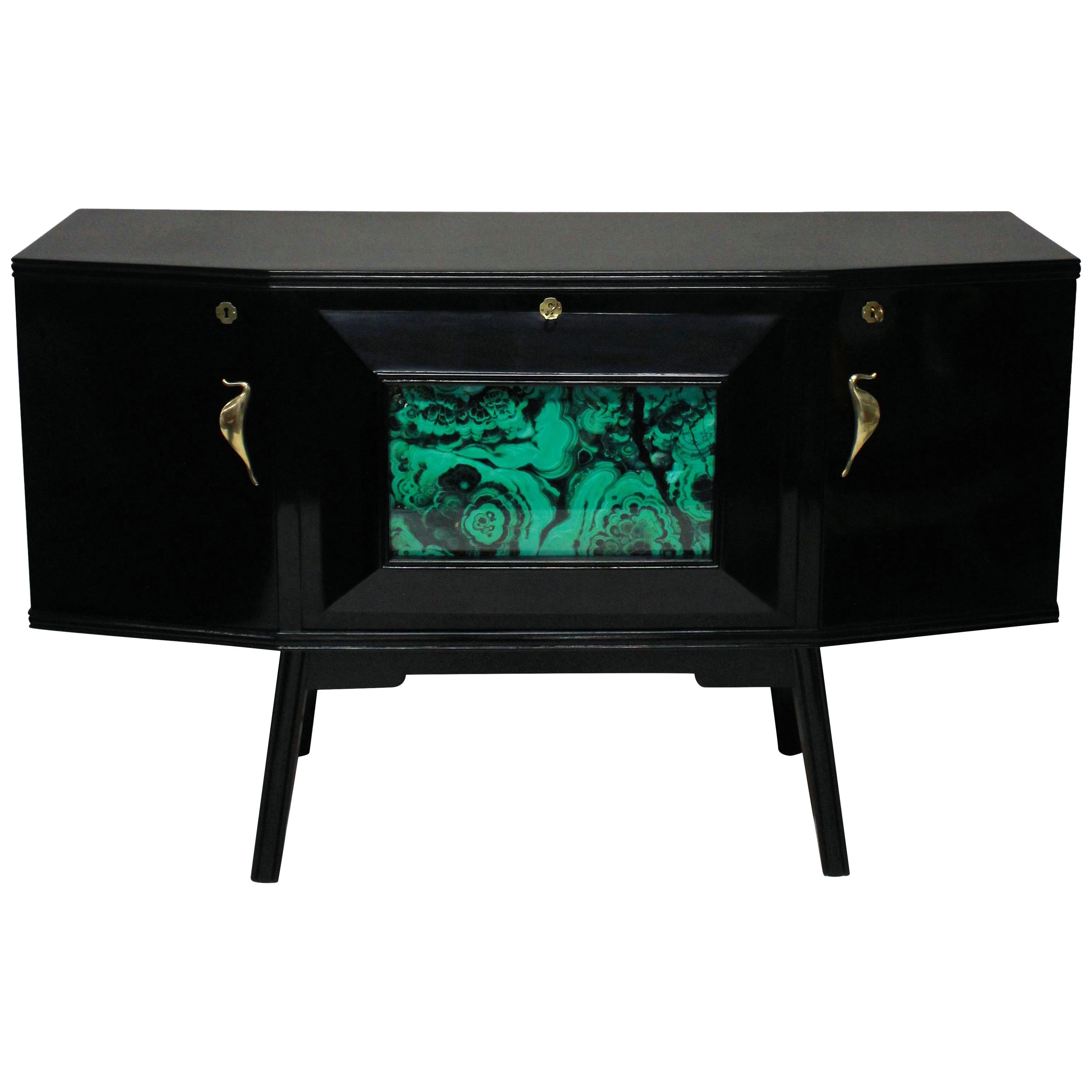 Lacquered Italian bar credenza stylish Italian bar credenza of interesting angular design in black lacquer with sepele wood interior, with brass hardware and a faux malachite central panel and mirrored interior.

