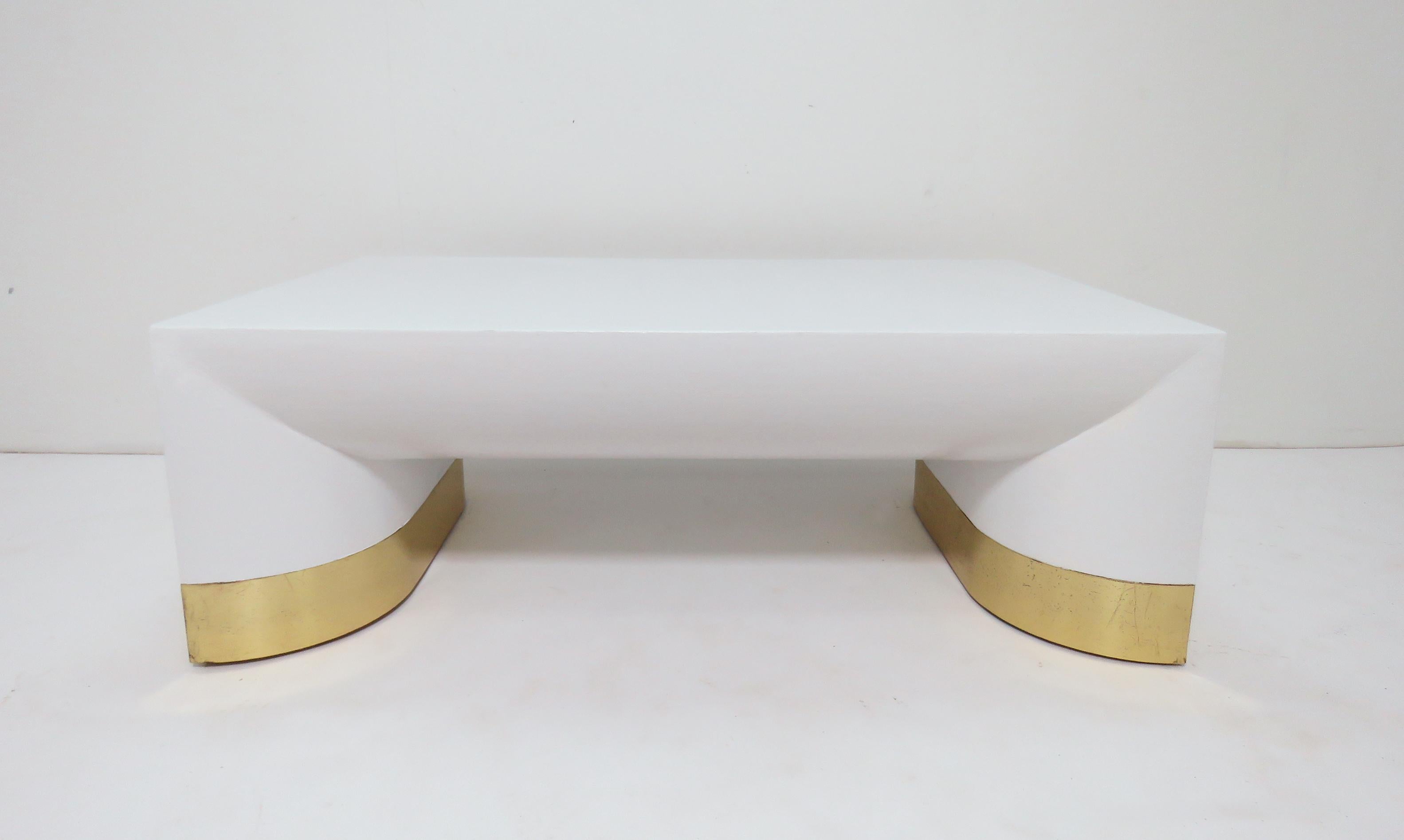 Large coffee table by Jay Spectre for Century Furniture in lacquered linen with brass toned metal accents at the legs, in the manner of Karl Springer.