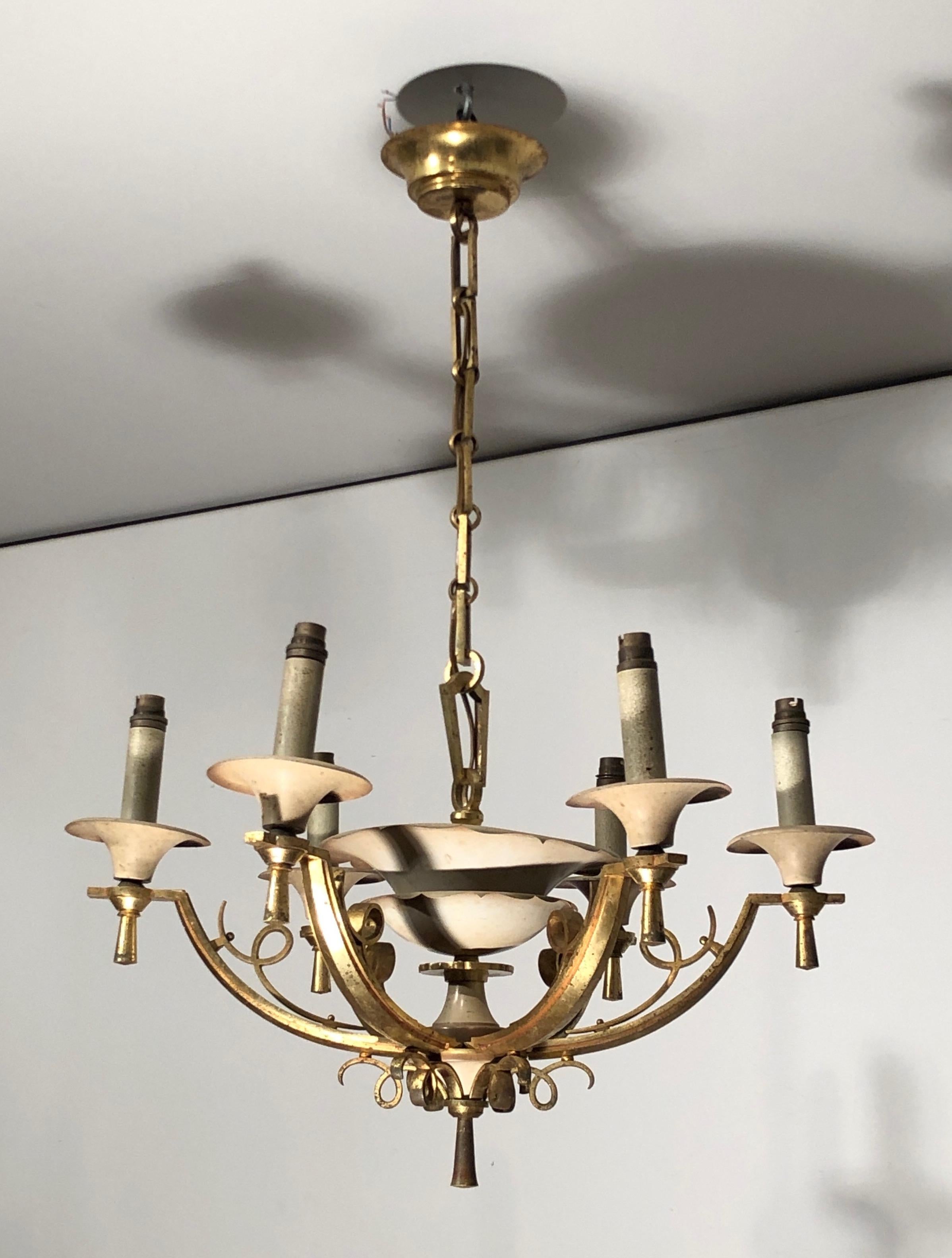 This very nice 6 lights chandelier. is made of acquered metal and brass. This is a French work. Circa 1940

