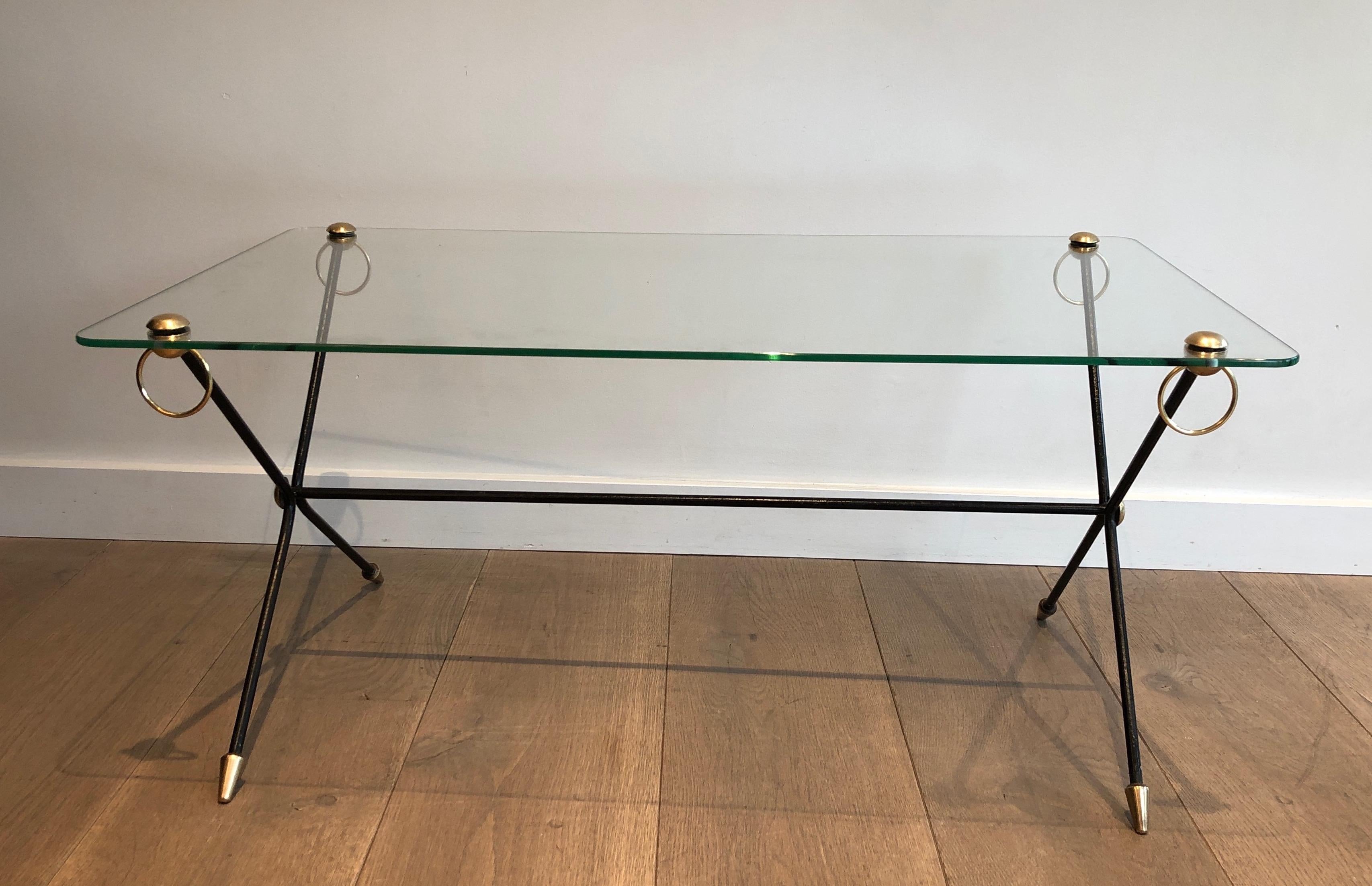This coffee table is made of lacquered metal, brass and glass. This is a very simple and chic model. French work by famous French designer Jacques Adnet. Circa 1950