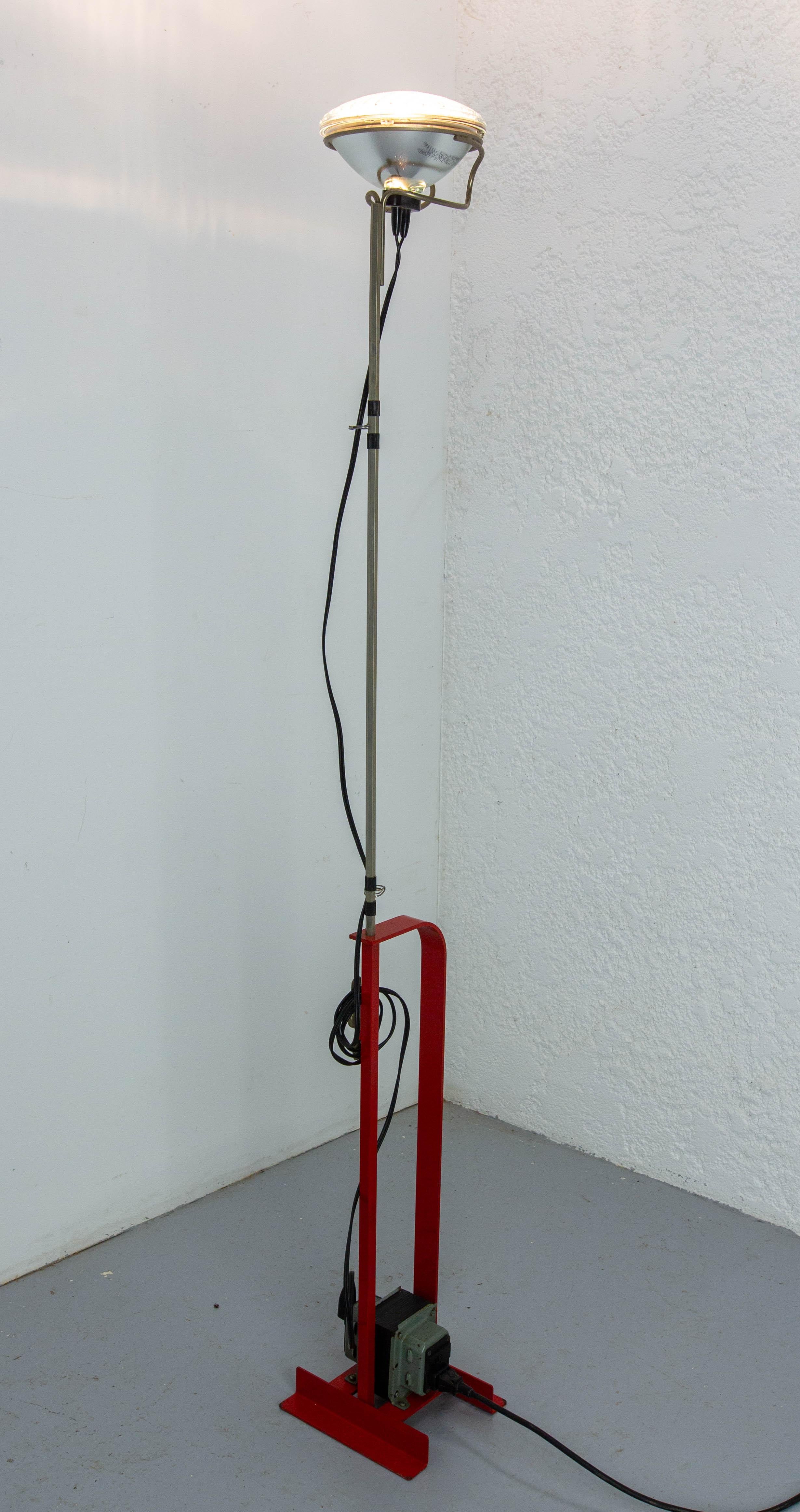 French floor lamp with indirect light. Base in cut and bent steel, structure in profiled steel, all finished in liquid paint. Hexagonal telescopic rod in nickel-plated brass, height-adjustable. 
Maximum height: 77 in. (195 cm)
Created in 1962 by