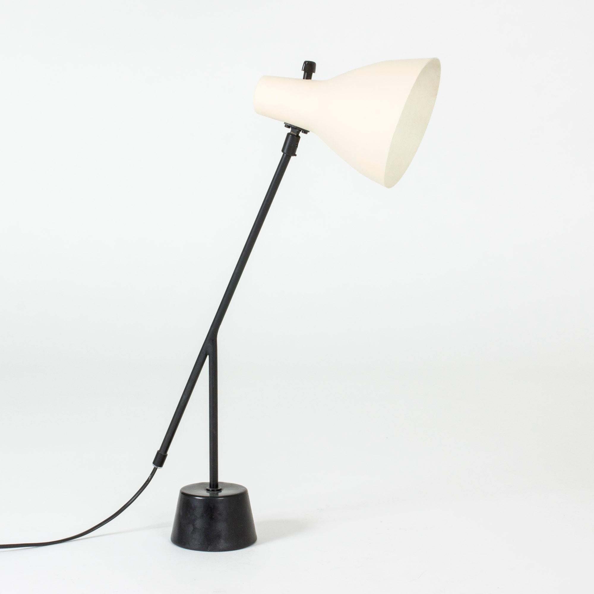 Cool desk lamp from AB Luco Göteborg. Black lacquered base and handle and contrasting off-white lacquered shade.