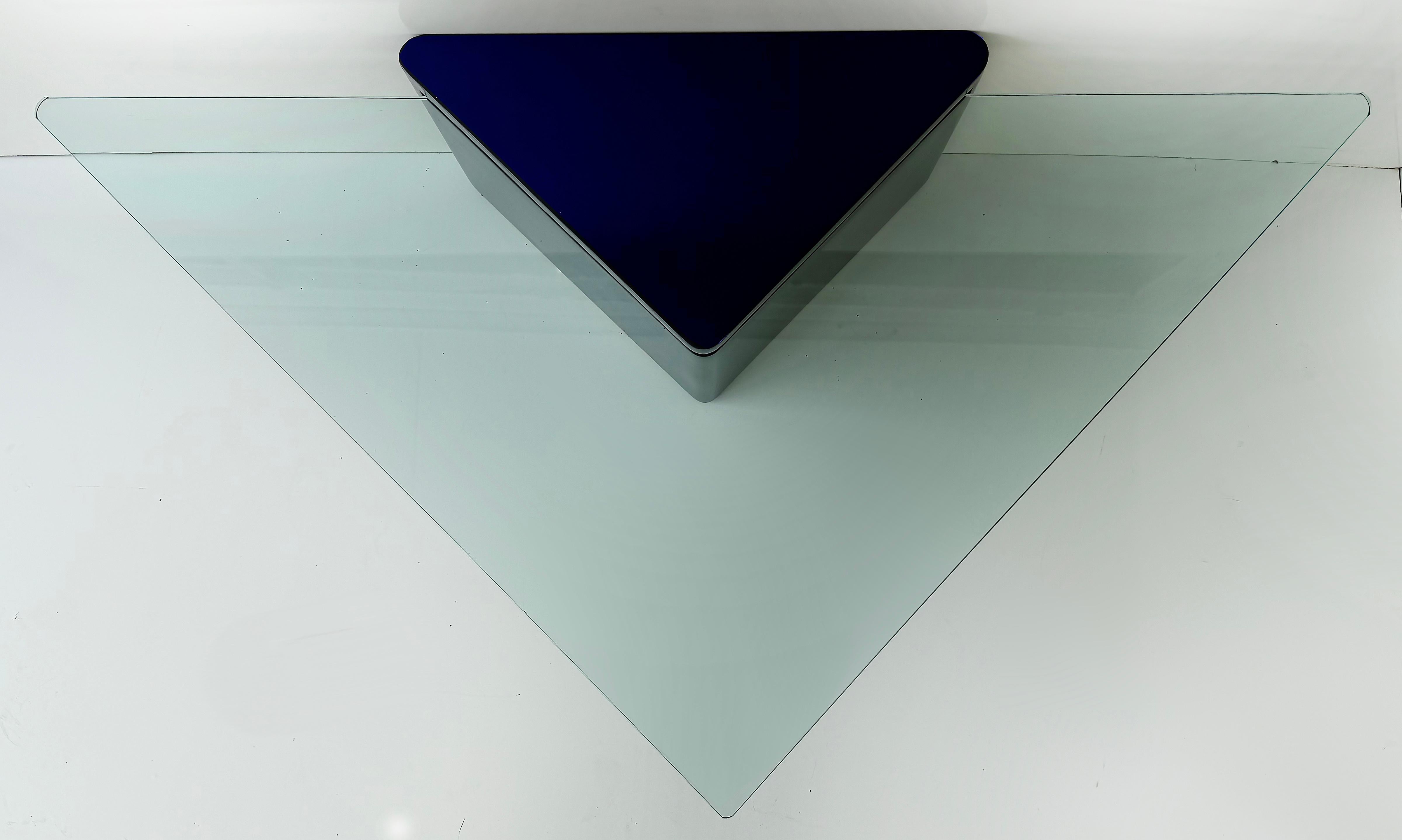 Lacquered Modern Triangle Coffee Tables with Glass Pair in Deep Midnight Blue

Offered for sale is a pair of deep midnight blue lacquered triangular form coffee tables with extending triangle shaped glass that cantilevers out from the bases.  These