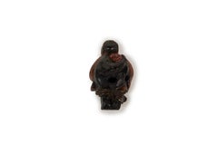 Lacquered Netsuke in the form of an old Lady carrying an Oni in her back