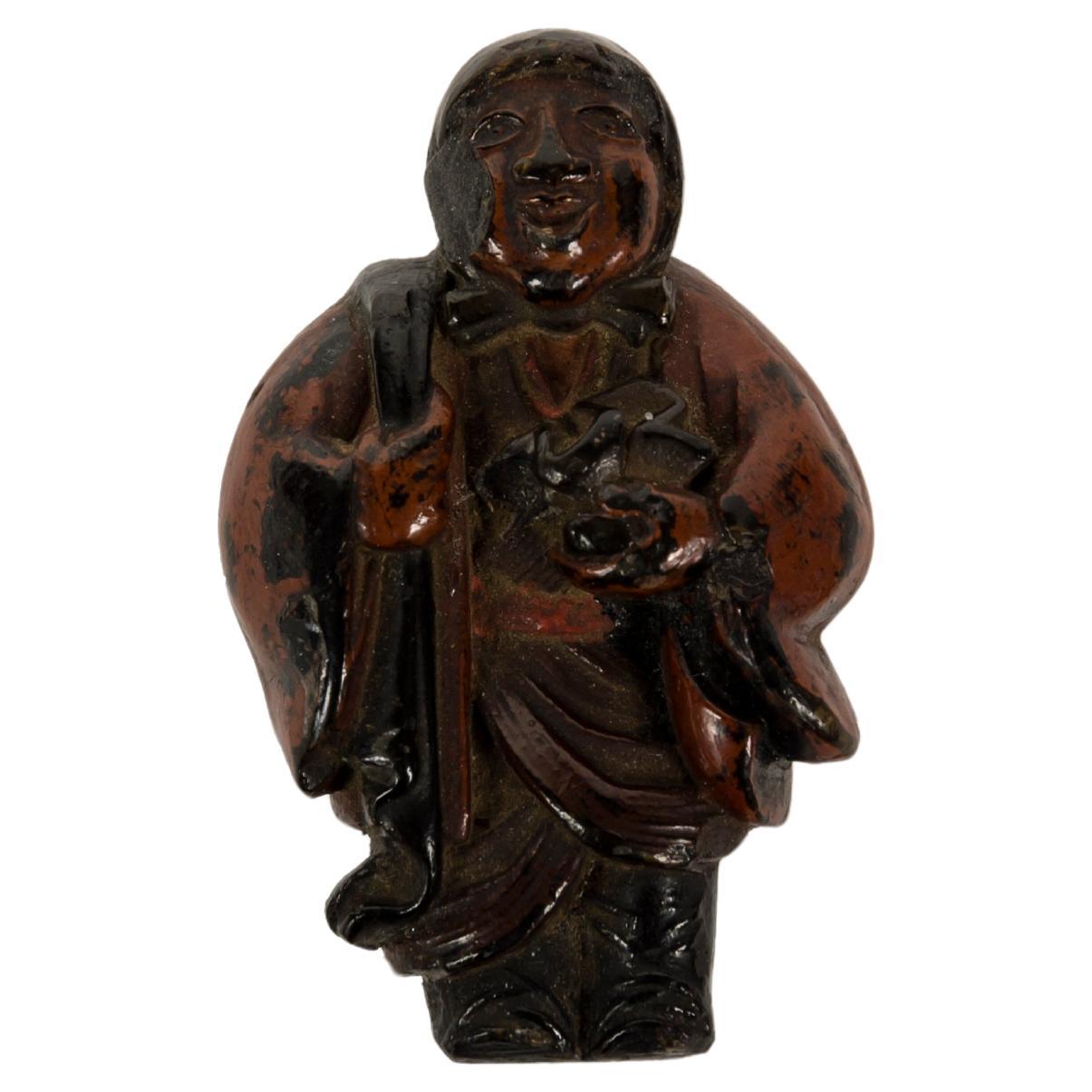 Lacquered Netsuke in the form of an old Lady carrying an Oni in her back