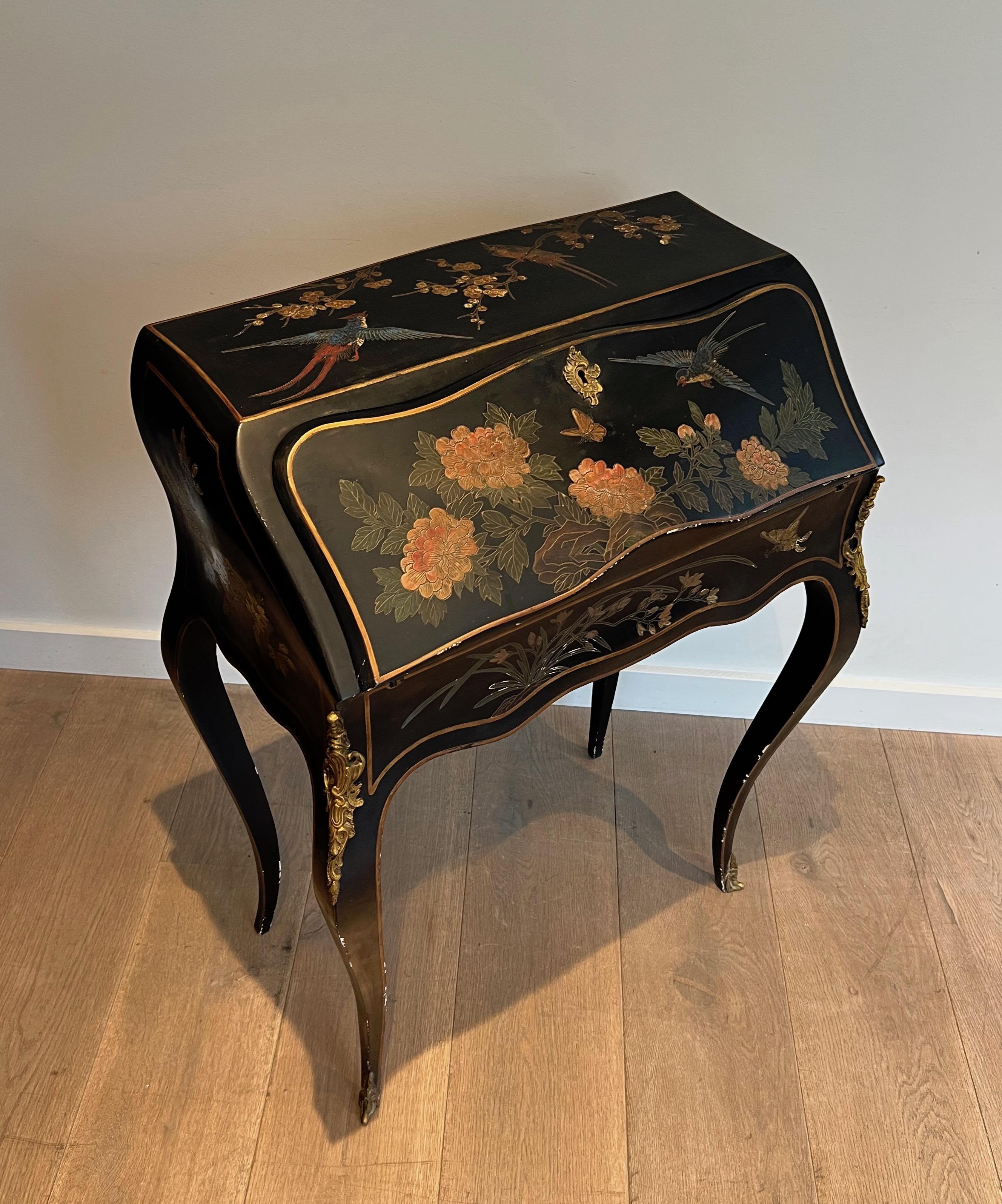 This very nice and decorative secretaire is made of lacquered wood with Chinese decorations, birds, flowers. This is a French work in the style of Maison Jansen, circa 1940.