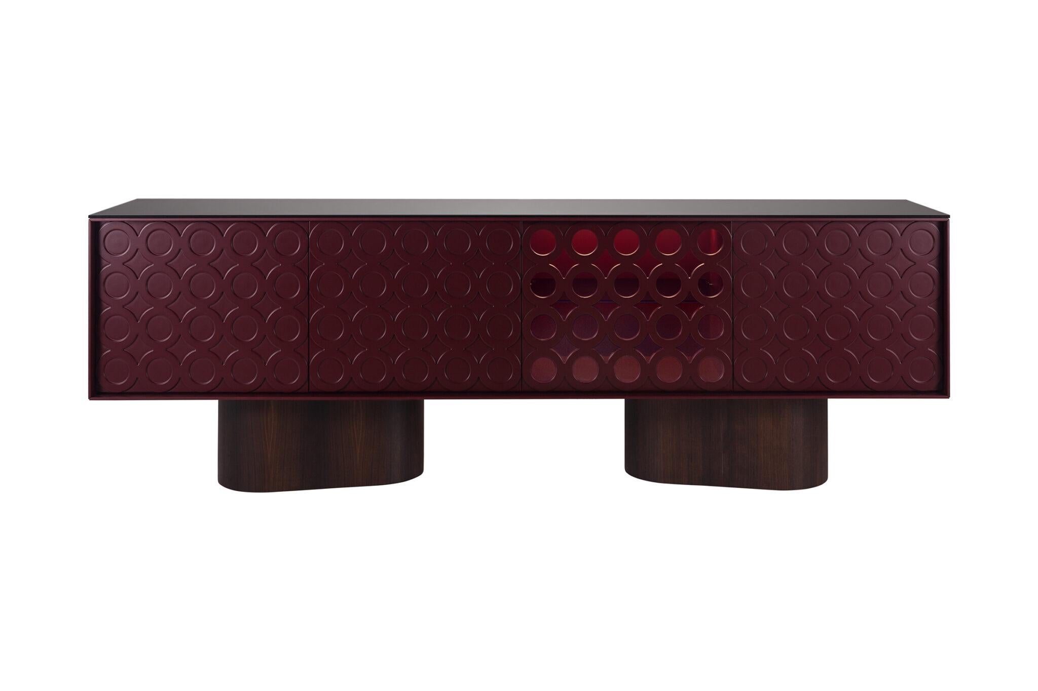 The Sculptural Lacquered Sideboard embodies contemporary craftsmanship through architectural balance and geometric precision. Its monolithic form is elevated on two bold, rounded bases, creating a floating illusion that enhances the piece’s