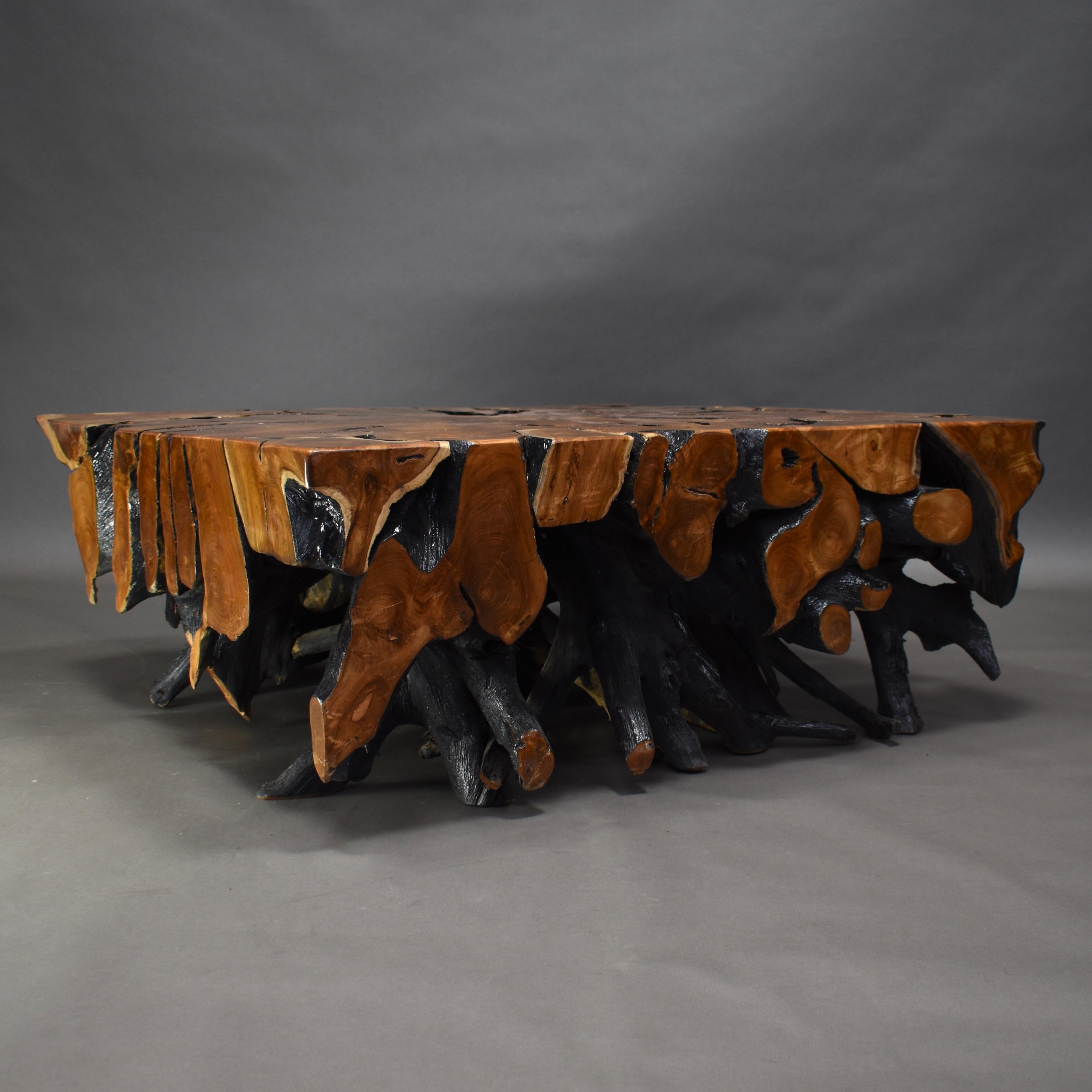 Square coffee table made of lacquered teak root.

Designer: Unknown

Manufacturer: Unknown

Model: Coffee table

Material: Teak root

Period: 20th-21st century

Size in cm: 110 x 110 x 42 cm.

Condition: Very good

Price on request.