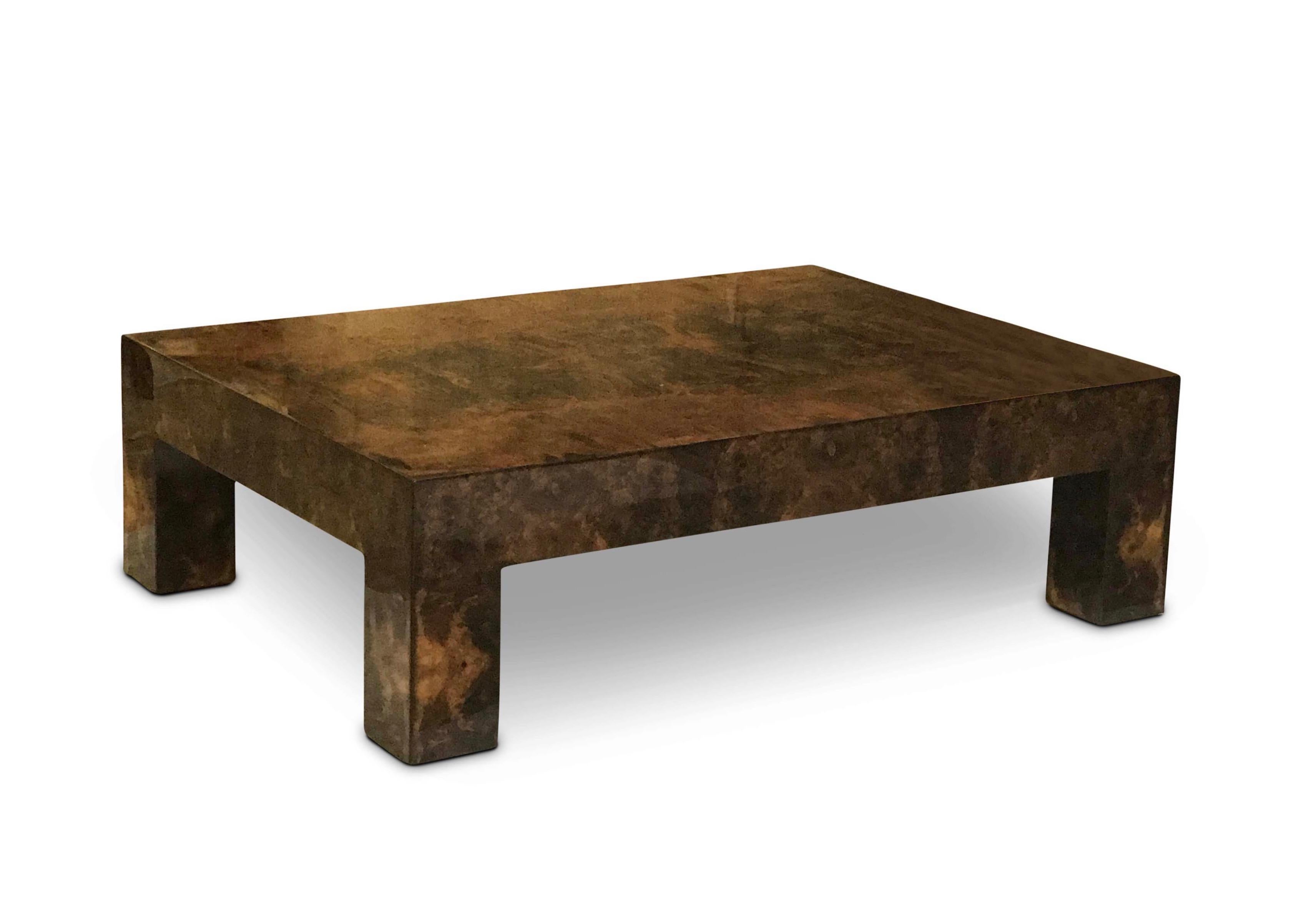 This large rectangular coffee table in walnut burl veneer has a high gloss lacquered finish.
The piece features straight lines and angles.
Burr or burl walnut veneer is taken from the specific part of the tree where ‘growths’ sprouting smaller