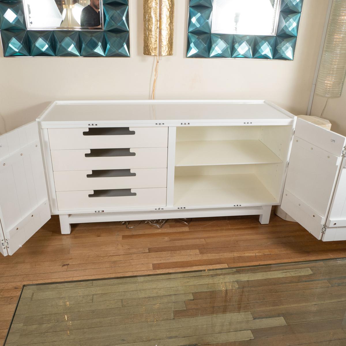 Lacquered wood and chrome sideboard with internal drawers. 