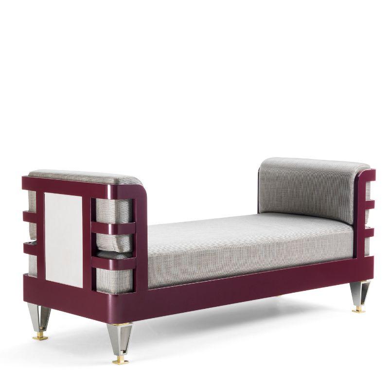 The perfect complement to an entryway decor, this bench features a clean and sophisticated design fashioned with first-rate materials. Resting on a burgundy-lacquered wood structure, it features brass and nickel feet of distinctive flair. It