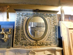 Lacquered wood mirror with rich carved carvings, Italy