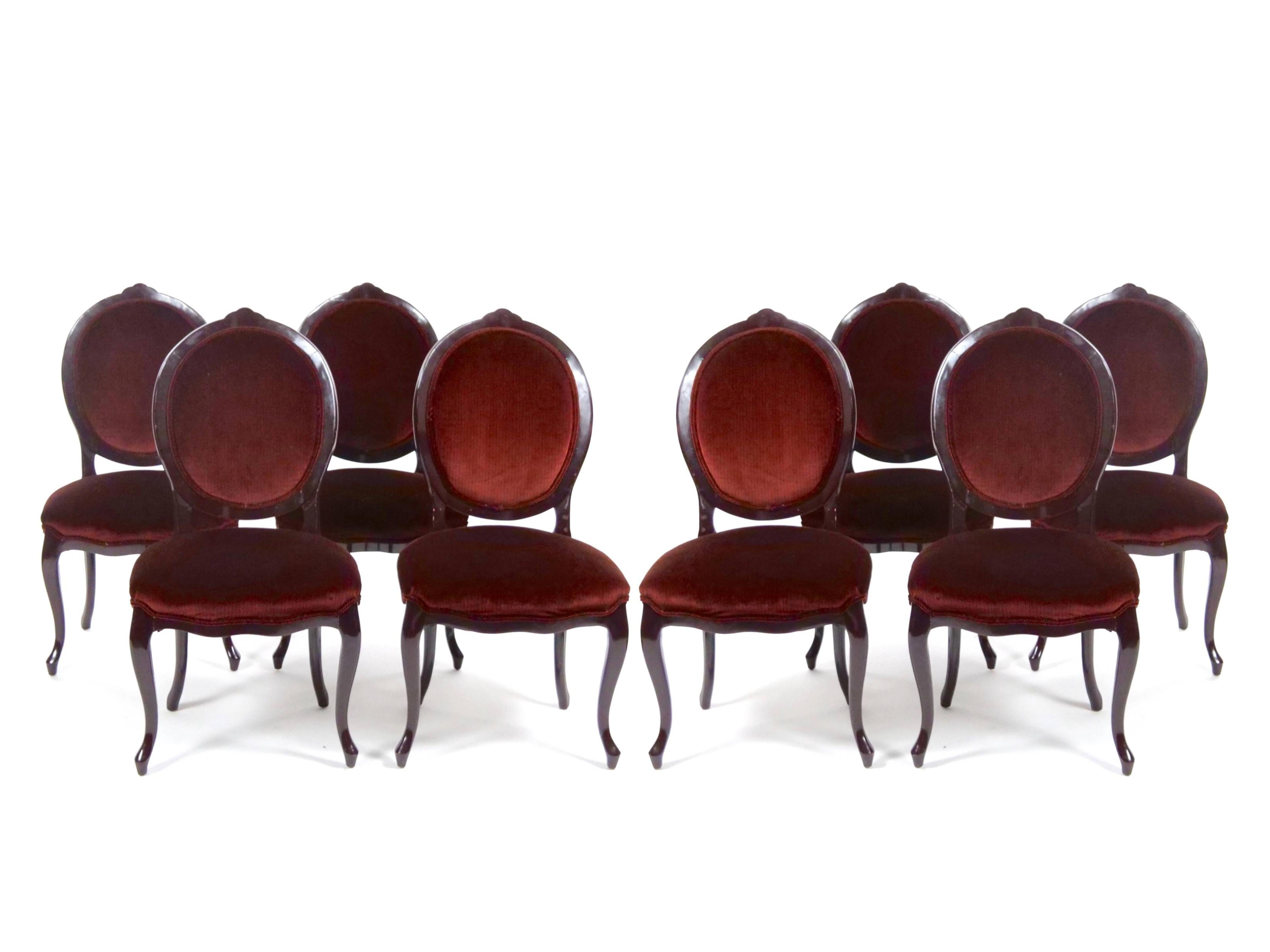 Elevate your dining experience with this exquisite set of eight lacquer painted dining chairs, inspired by the grand French Louis XVI style. Each chair is meticulously crafted with beautifully carved frames, showcasing oval cameo or balloon-shaped