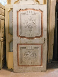 Lacquered wooden door, one leaf with painted panels, Italy