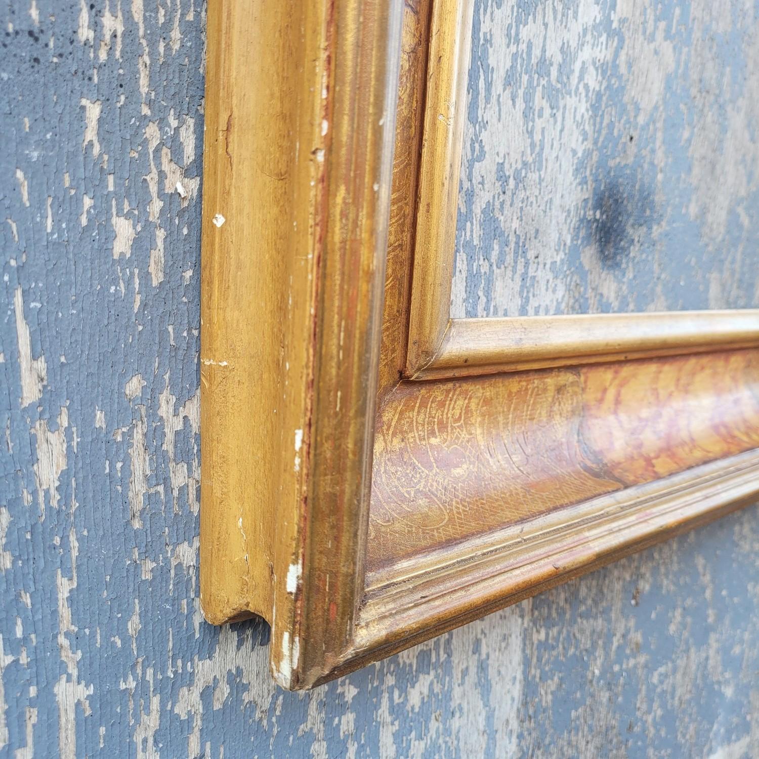 Lacquered, gilded, and marble-effect painted wooden frame in the 17th-century style. 

 Wear and chips consistent with age.  

 Ideal for a mirror (sold as a frame, without mirror)

 Late 19th/early 20th century.  

Frame dimensions: 67 x 55 x 5 cm.