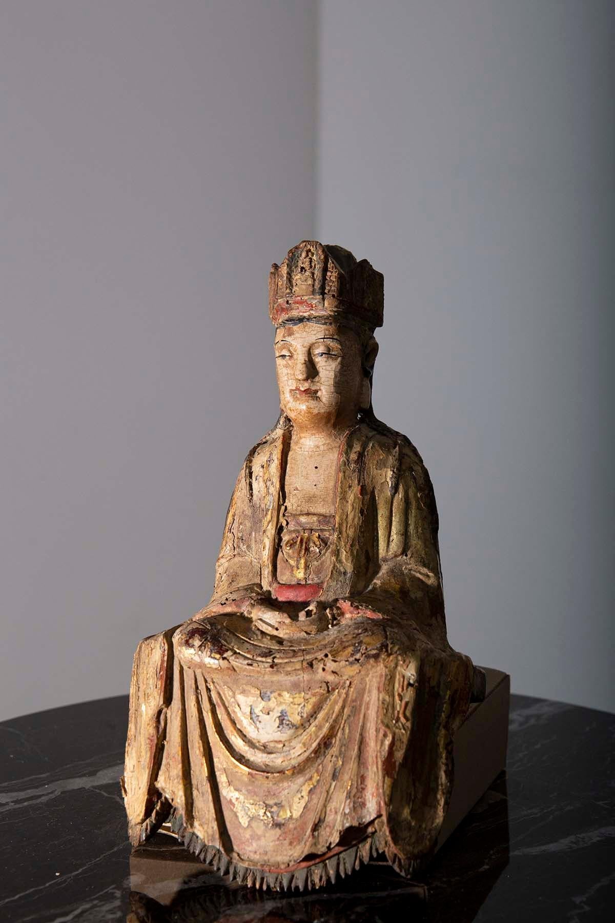 In a realm where time stands still, there exists a 16th-century masterpiece, a sculpture of unparalleled beauty that transports you to the heart of the Ming dynasty. Here, in a place of reverence and artistry, sits the Chinese Bodhisattva Guanyin,