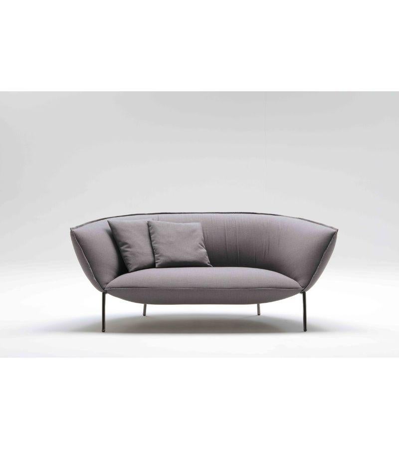 Lacquered You sofa by Luca Nichetto 
Materials: Lacquered metal structure. Fabric upholstery. Structure colors: Black chrome, red or beige lacquered. Seat and back coated with polyurethane foam expanded with a density of 50 kg and 35 kg square meter