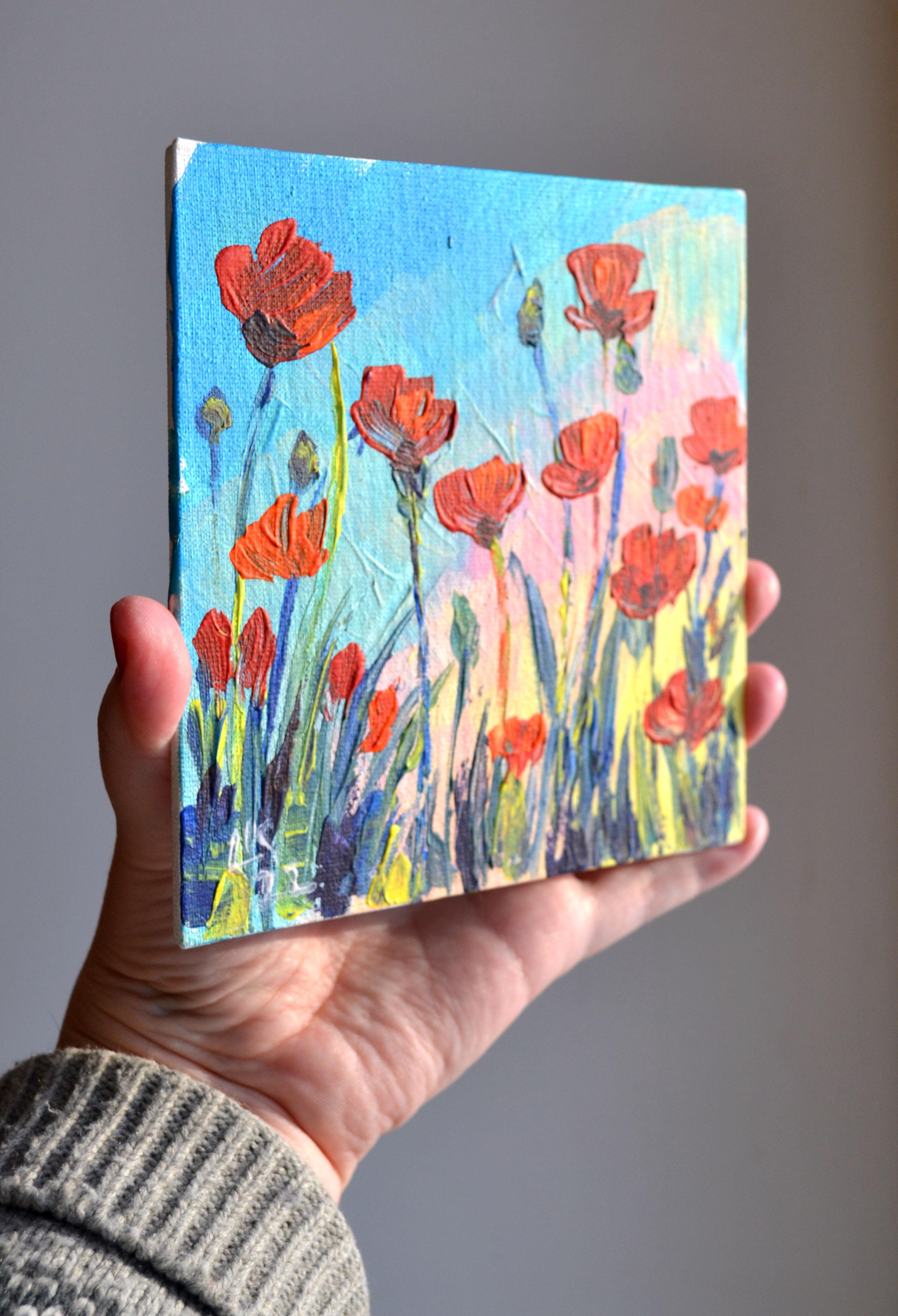 This hand-painted acrylic artwork, created in 2022 in Estonia on a small canvas board, features vibrant red poppies reaching towards a colorful sky. The expressive brushstrokes and dynamic composition evoke the energy and beauty of nature, making it