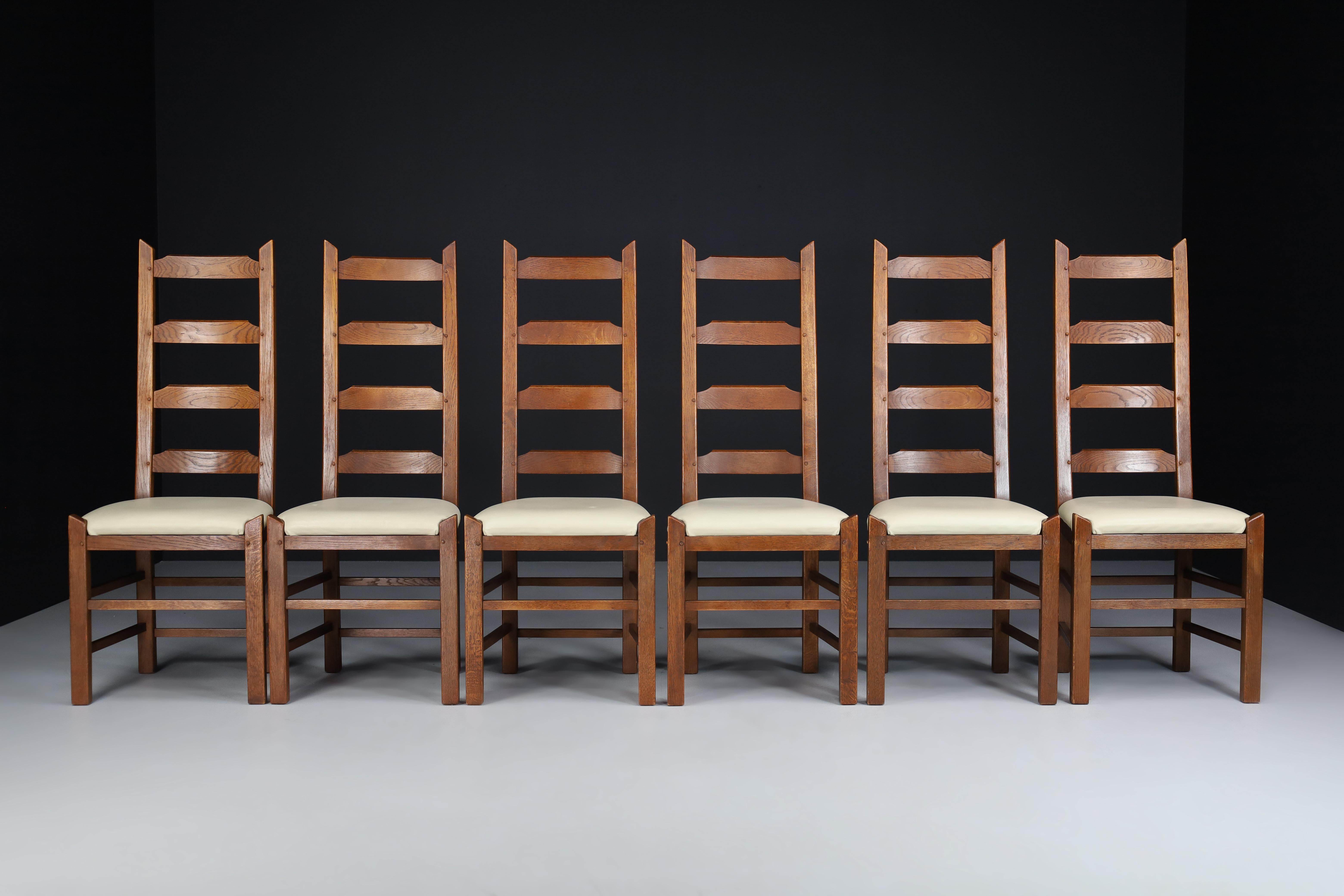 Ladder back chairs crafted in oak and leather seats, France 1950s

These six brutalist chairs were crafted in France circa the 1950s. Each chair is made of solid oak and stands on carved rustic legs embellished with a leather seat. Each chair has a