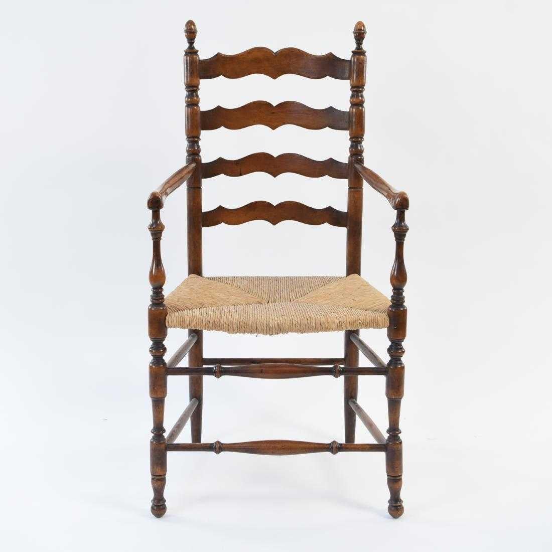 Classic English ladder back dining, kitchen or desk armchair with turned bobblns at the top of each side rail. Double stretchers on three sides adds structural soundness.