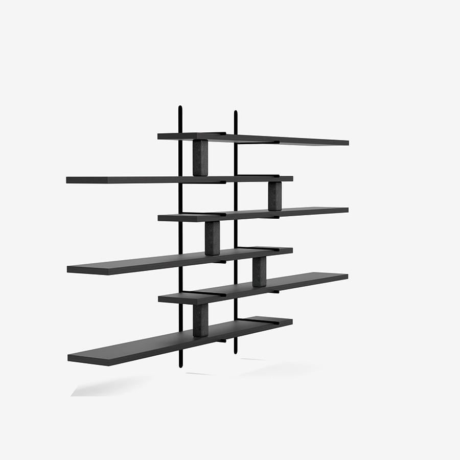 This ladder street shelving by Yabu Pushelberg in black pepper stained matte oak is paired with belgian bluestone accents.

The ladder street shelving unit by Yabu Pushelberg also rests on a foundation of solid stone in Carrara marble and/or