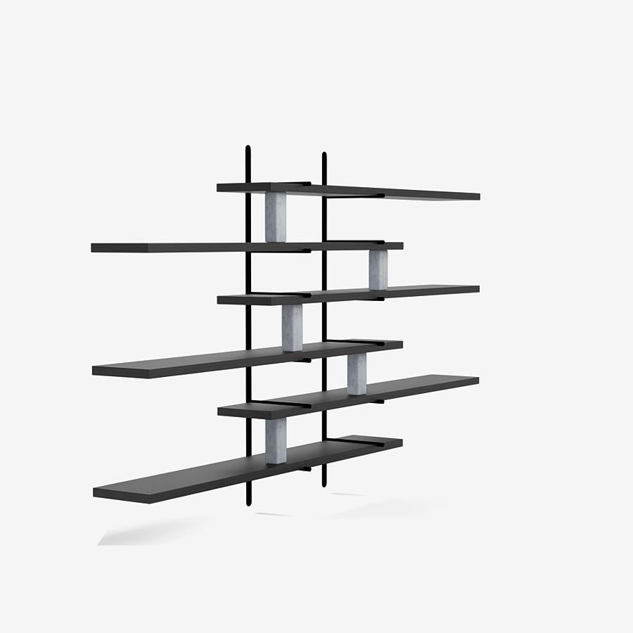 This ladder street shelving by Yabu Pushelberg in black pepper stained matte oak is paired with carrara marble accents.

The ladder street shelving unit by Yabu Pushelberg also rests on a foundation of solid stone in Carrara marble and/or Belgian