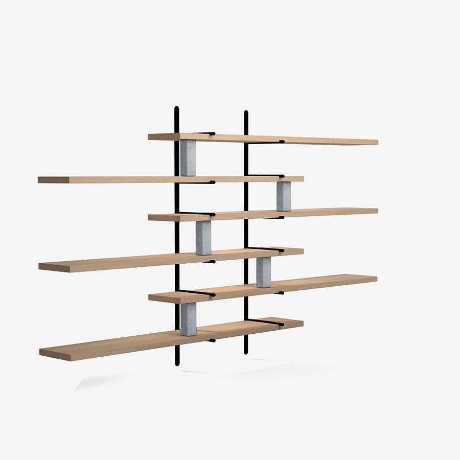 This ladder street shelving by Yabu Pushelberg in nude brushed ultra matte lacquered oak is paired with Carrara marble accents.

The ladder street shelving unit by Yabu Pushelberg also rests on a foundation of solid stone in Carrara marble and/or