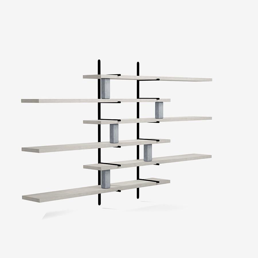 This ladder street shelving by Yabu Pushelberg in ivory ultra matte lacquered oak is paired with Carrara marble accents.

The ladder street shelving unit by Yabu Pushelberg also rests on a foundation of solid stone in Carrara marble and/or Belgian