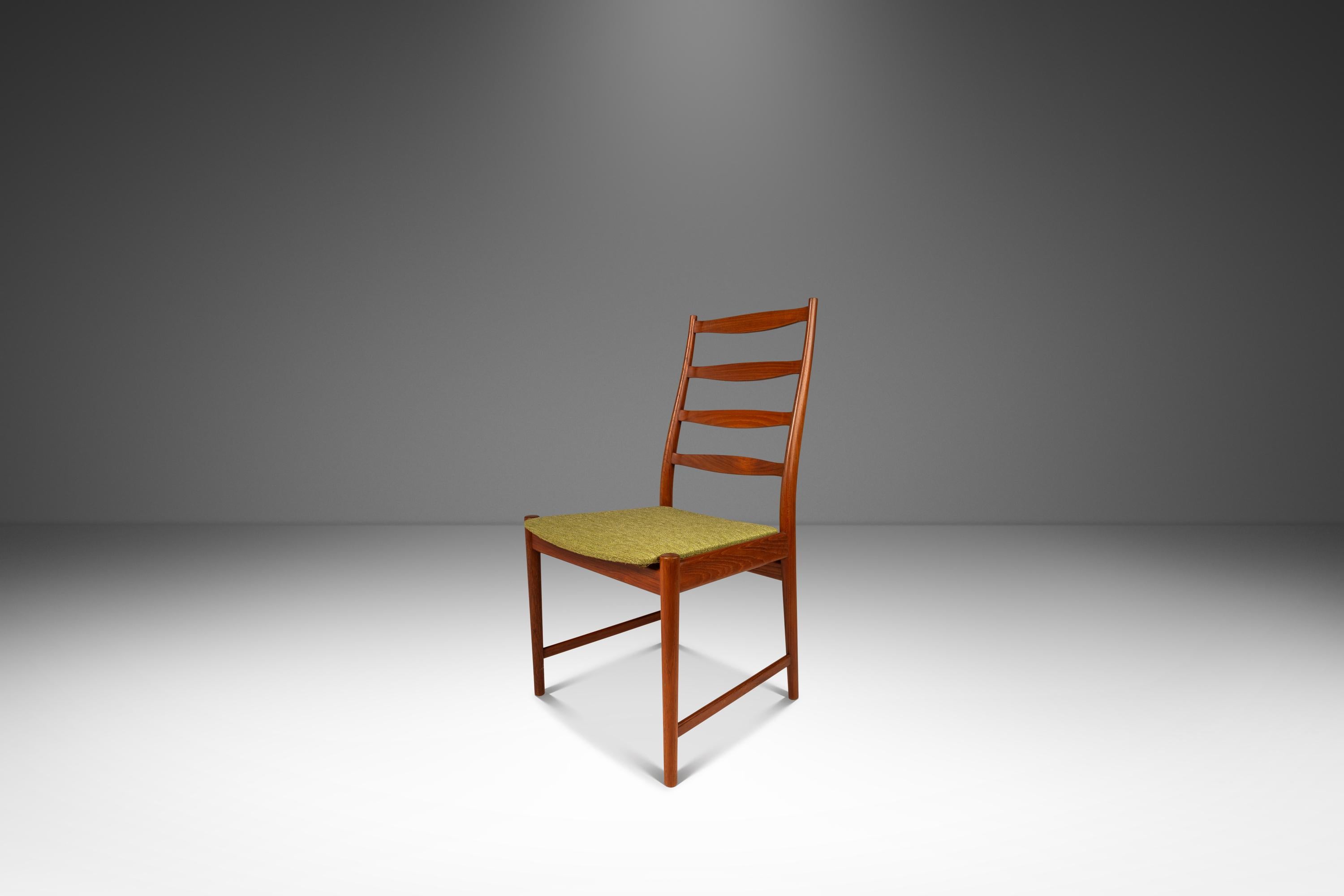 Introducing a rare ladderback side chair designed by the incomparable Torbjørn Afdal for Vamo. Designed and crafted in Denmark in the early 1960's this elegant chair is constructed from solid teak with graceful curves and exquisite woodgrains