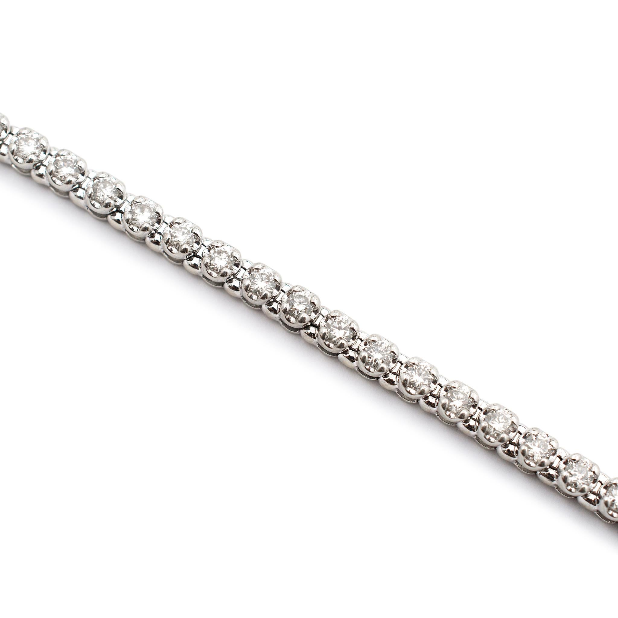Gender: Ladies

Metal Type: 10K White Gold

Length: 7.00 inches

Width: 3.20 mm

Weight: 9.90 grams

Ladies 10K white gold, diamond tennis bracelet. Engraved with 