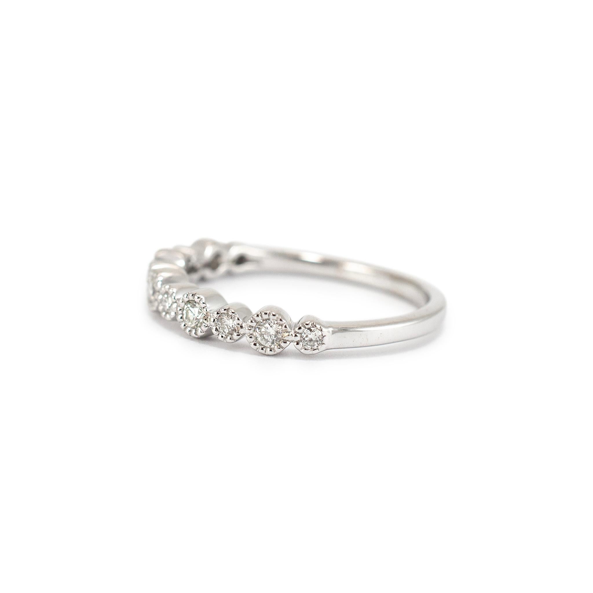 Gender: Ladies

Metal Type: 10K White Gold

Size: 6.5

Width: 3.05 mm

Weight: 1.77 grams


One ladies custom made polished 10K white gold diamond wedding band with a half-round shank. The metal was tested and determined to be 10K white gold.