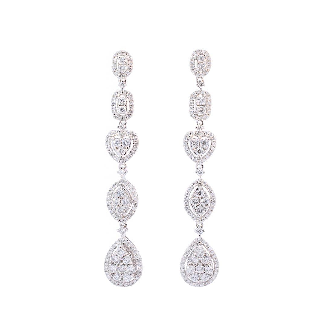 Gender: Ladies

Metal Type: 10K White Gold

Length: 2.00 inches

Shank Width: 8.55mm tapering to 4.56mm

Total Weight: 5.97 grams

10K White gold diamond drop earrings with push-backs. Engraved with 