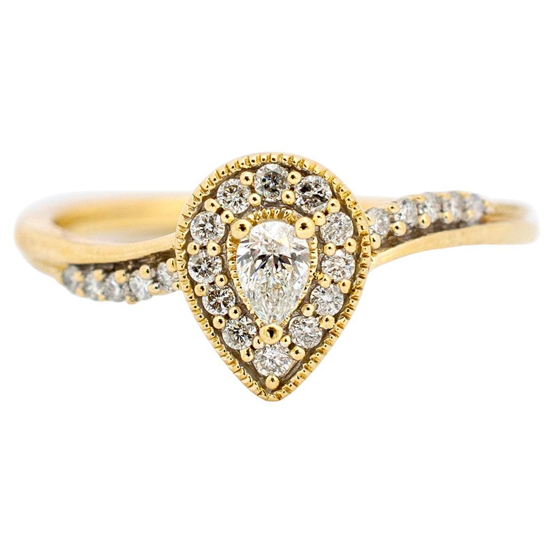 Ladies 10K Yellow Gold Pear Shaped Halo Diamond Waved Accented Engagement Ring
