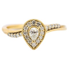 Ladies 10K Yellow Gold Pear Shaped Halo Diamond Waved Accented Engagement Ring