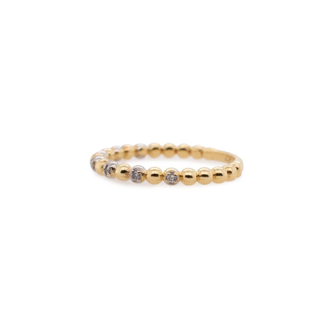 One ladies custom made polished 10K white & yellow gold seven-across, diamond stackable ring with a half round shank. The ring is a size 5.75 and is 1.04mm thick tapering to 1.90mm in width. The ring weighs a total of 1.70 grams. Engraved with