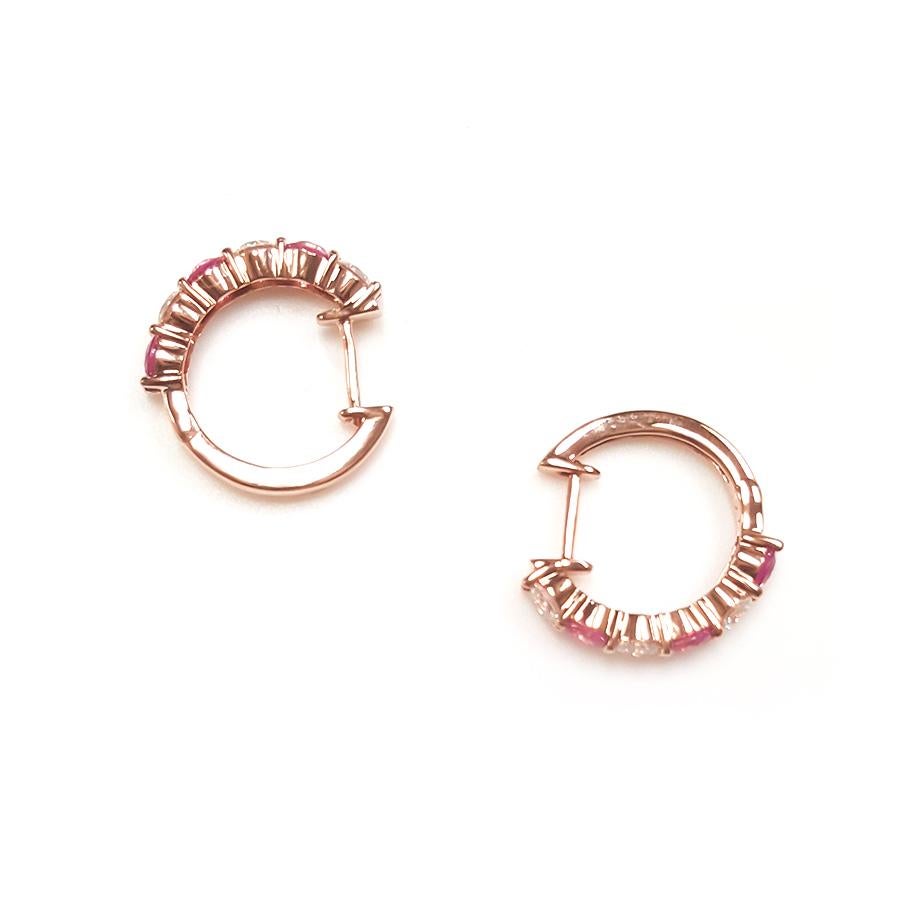 These ladies 14k rose gold round pink sapphire hoop earrings have 0.96ct of perfectly matched pink sapphire and 0.76ct of perfectly matched round diamonds. Comfort fit earrings for everyday use.