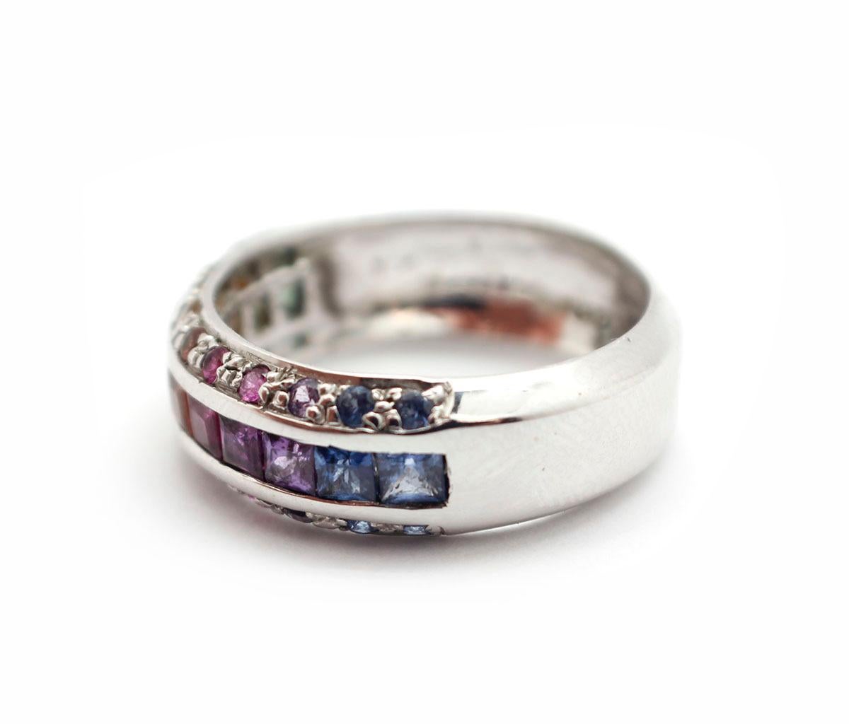 This gorgeous 14k white gold rainbow sapphire ring is amazing! The ring features a total of 1.60ct princess cut and round cut sapphire stones that range in color from green to blue. The ring weighs a total of 5.44 grams and is a size 7.
