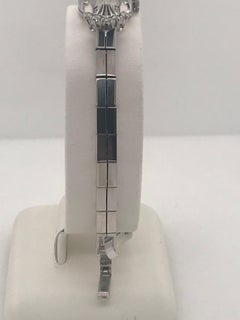 Ladies 14 Karat White Gold and diamond Bulova wristwatch